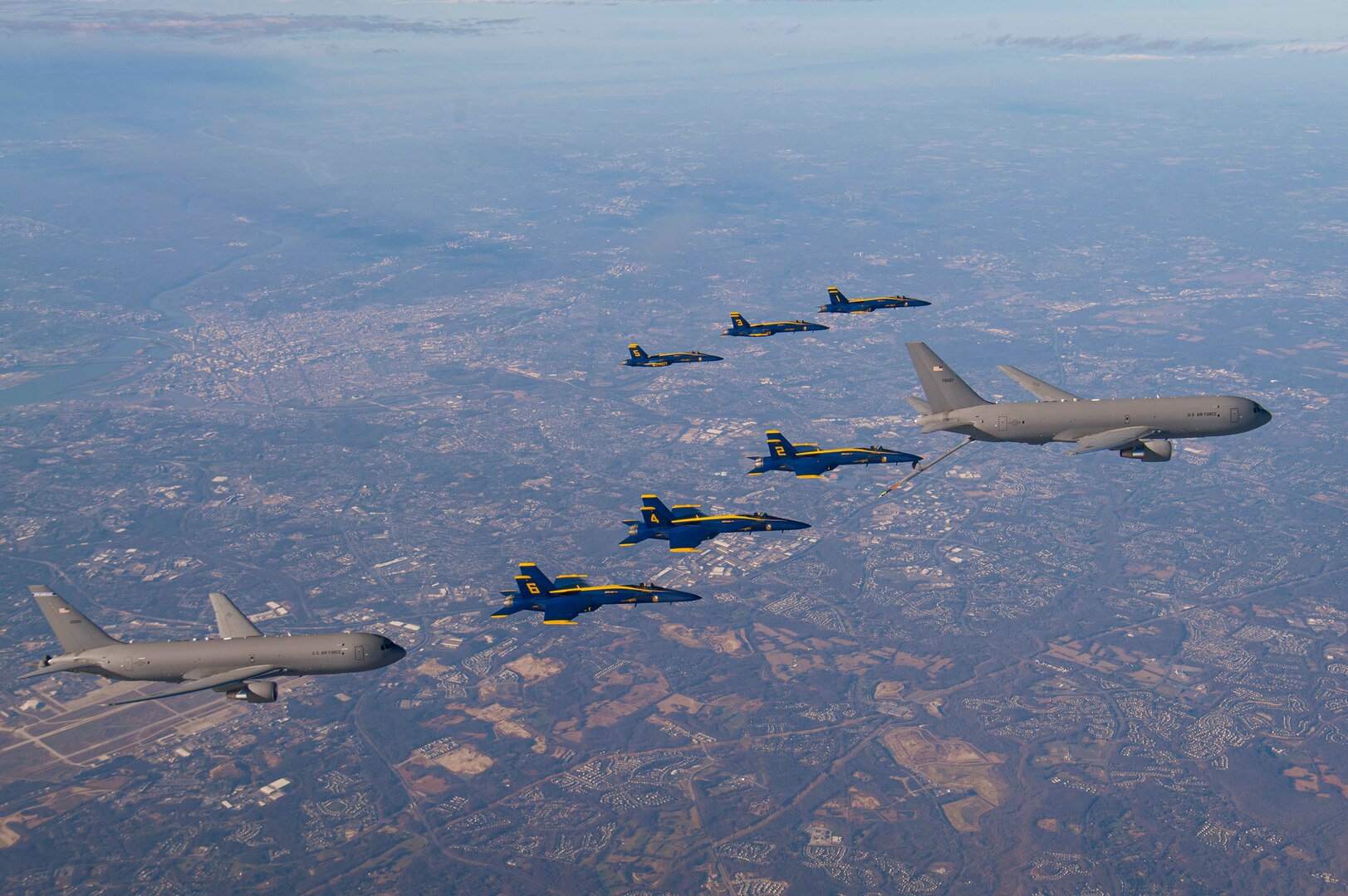 U.S. Navy Flight Demonstration Squadron, the Blue Angels, and two U.S. Air Force KC-46 aircraft assigned to the 157th Air Refueling Wing, New Hampshire National Guard and 22nd Air Refueling Wing, fly in formation during a refueling evolution while in transit for the 2020 Army-Navy Game.