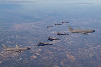 U.S. Navy Flight Demonstration Squadron, the Blue Angels, and two U.S. Air Force KC-46 aircraft assigned to the 157th Air Refueling Wing, New Hampshire National Guard and 22nd Air Refueling Wing, fly in formation during a refueling evolution while in transit for the 2020 Army-Navy Game.