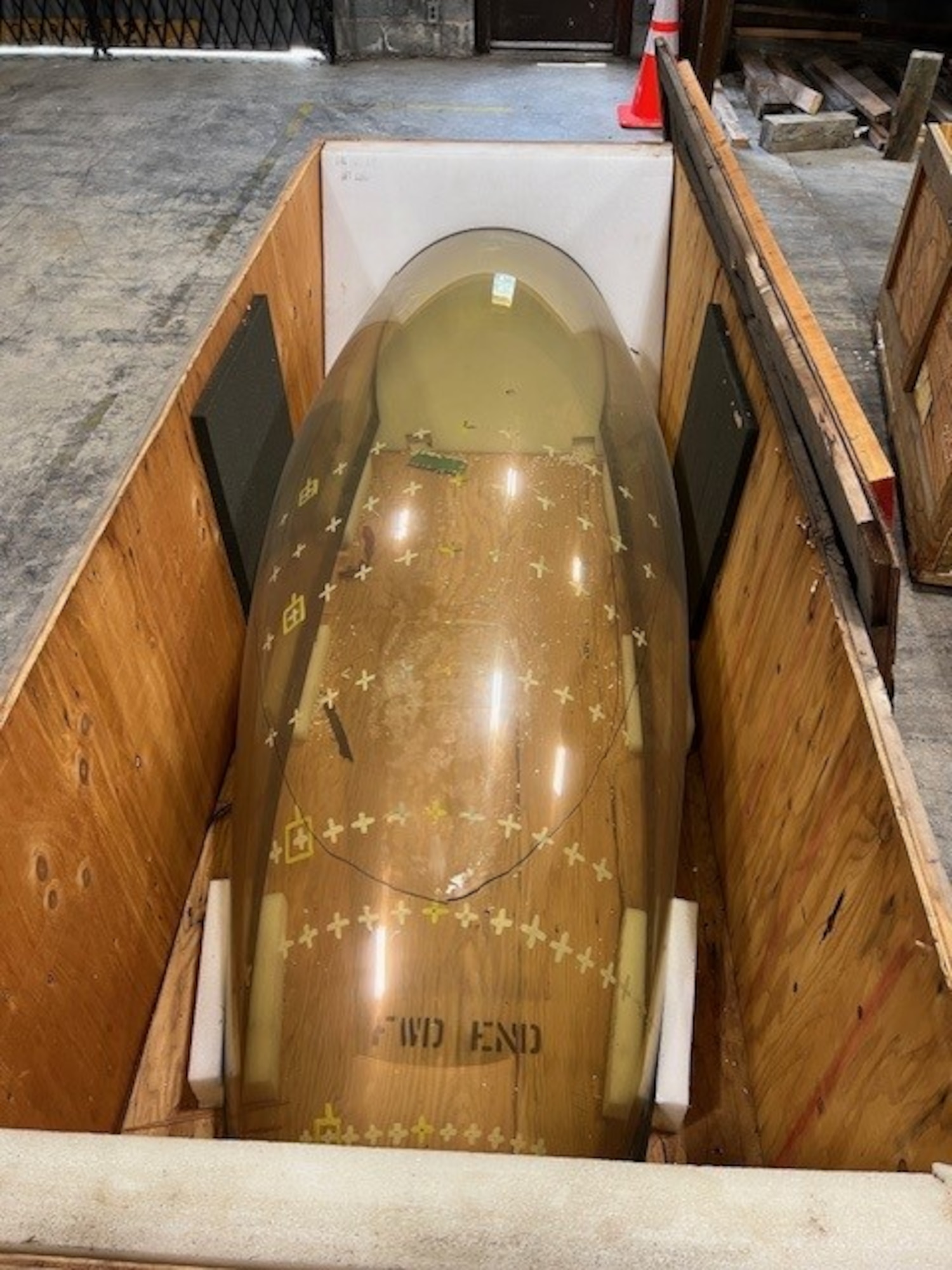 An F-16 Fighting Falcon aircraft canopy is pictured in a warehouse at Arnold Air Force Base, Tenn. It is believed the canopy was slated to be used in bird strike testing at the S-3 Bird Impact Range at Arnold, more famously known as the “Chicken Gun,” but the canopy ended up not being used in such testing. Several canopies and a drone engine from the 1980s stored in the warehouse since the late 1980s to early 1990s were shipped this summer to the Air Force Materiel Command History and Heritage Directorate for possible display. (Courtesy photo)
