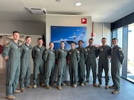U.S. Air Force student pilots pose for a group photo during the undergraduate flying training program Small Group Tryout at the International Flight Training School, Decimomannu Air Base, Italy.