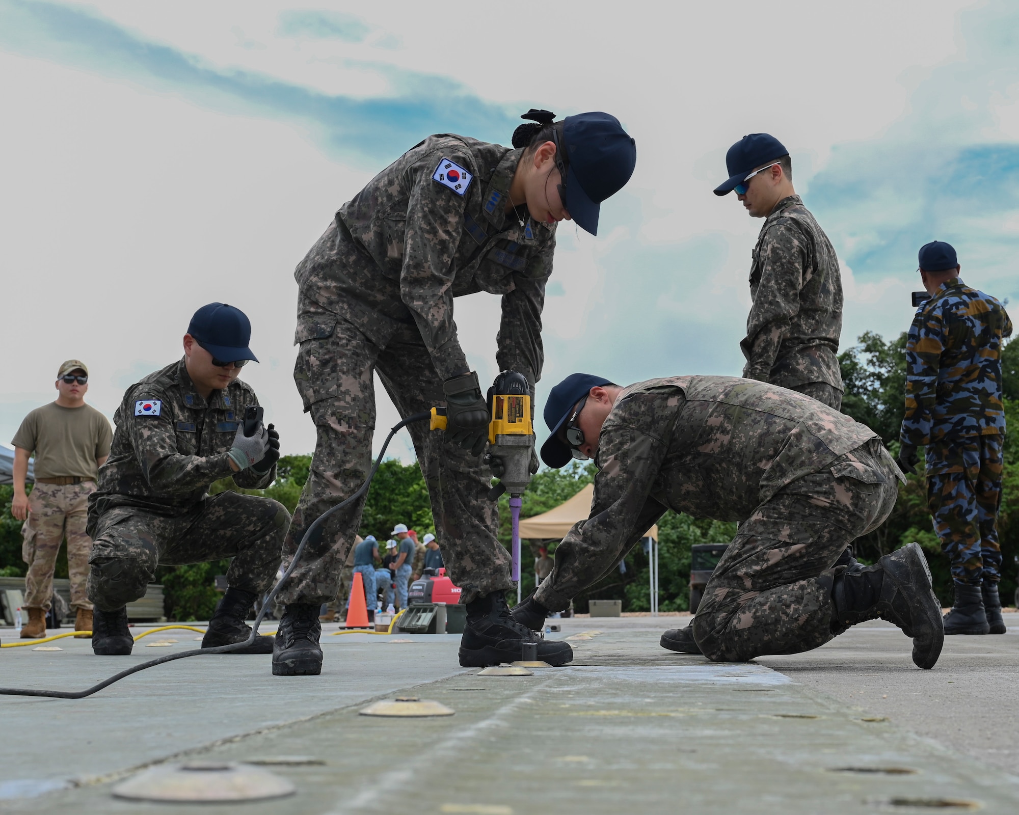Republic of Korea Air Force airmen use the tools provided to finish their tasks.