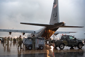U.S. Air Force Airmen assigned to the 374th Airlift Wing offload equipment and supplies from a C-130J Super Hercules assigned to the 36th Airlift Squadron during a foreign disaster relief operation at Clark Air Base, Philippines.