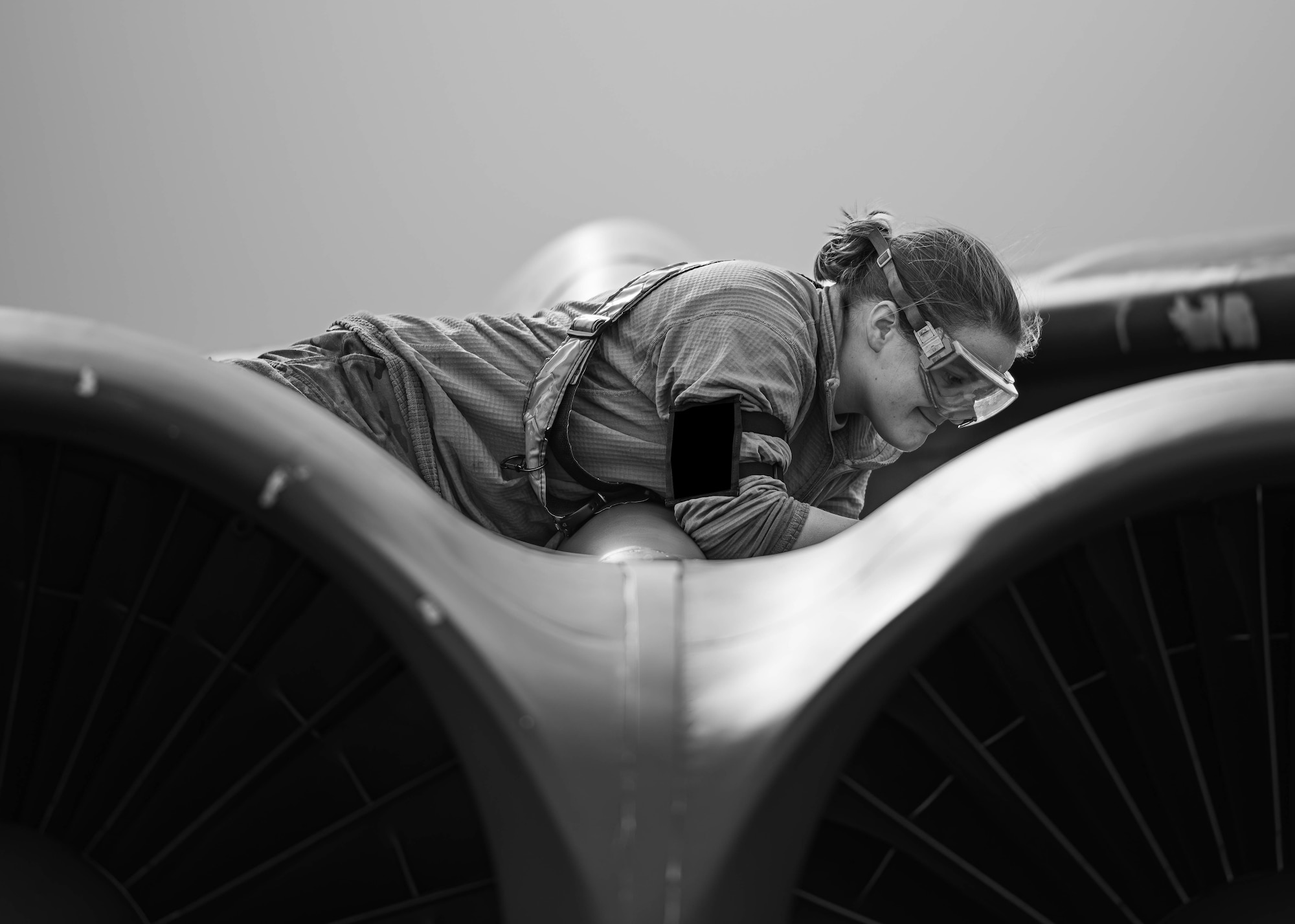 Senior Airman Bethany Jones, 23rd Bomber Generation Squadron crew chief, performs maintenance on a U.S. Air Force B-52H Stratofortress assigned to the 2nd Bomb Wing, Barksdale Air Force Base, Louisiana, as part of Exercise Global Thunder 26 at Minot Air Force Base, North Dakota, Oct. 19, 2025. Global Thunder is an annual command and control exercise designed to train U.S. Strategic Command forces and assess joint operational readiness. (U.S. Air Force photo by Senior Airman Kyle Wilson)