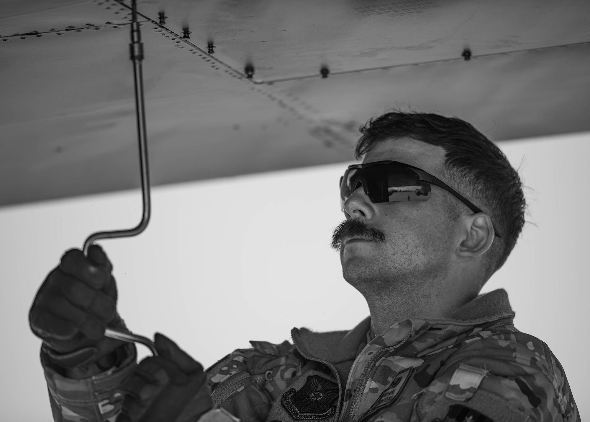 Senior Airman John Richters, 96th Bomb Squadron crew chief, performs maintenance on B-52H Stratofortress assigned to the 2nd Operations Group, Barksdale Air Force Base, Louisiana, as part of Exercise Global Thunder 26 at Minot Air Force Base, North Dakota, Oct. 19, 2025. Global Thunder is an annual command and control exercise designed to train U.S. Strategic Command forces and assess joint operational readiness. (U.S. Air Force photo by Senior Airman Kyle Wilson)