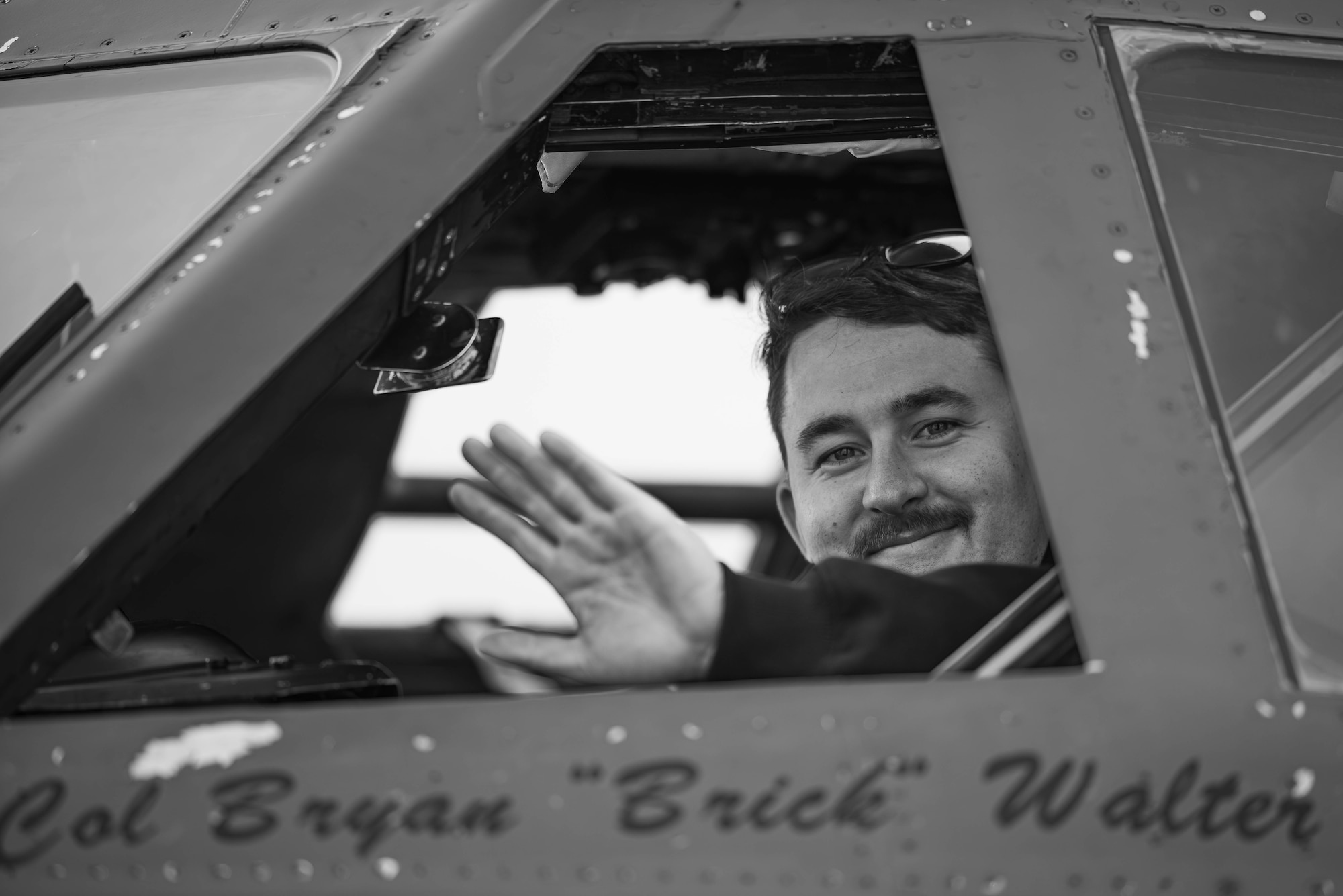 U.S. Air Force Staff Sgt. Josiah Holdford, 20th Bomber Generation Squadron crew chief, waves as part of Exercise Global Thunder 26 at Minot Air Force Base, North Dakota, Oct. 19, 2025. Global Thunder is an annual command and control exercise designed to train U.S. Strategic Command forces and assess joint operational readiness. (U.S. Air Force photo by Senior Airman Kyle Wilson)