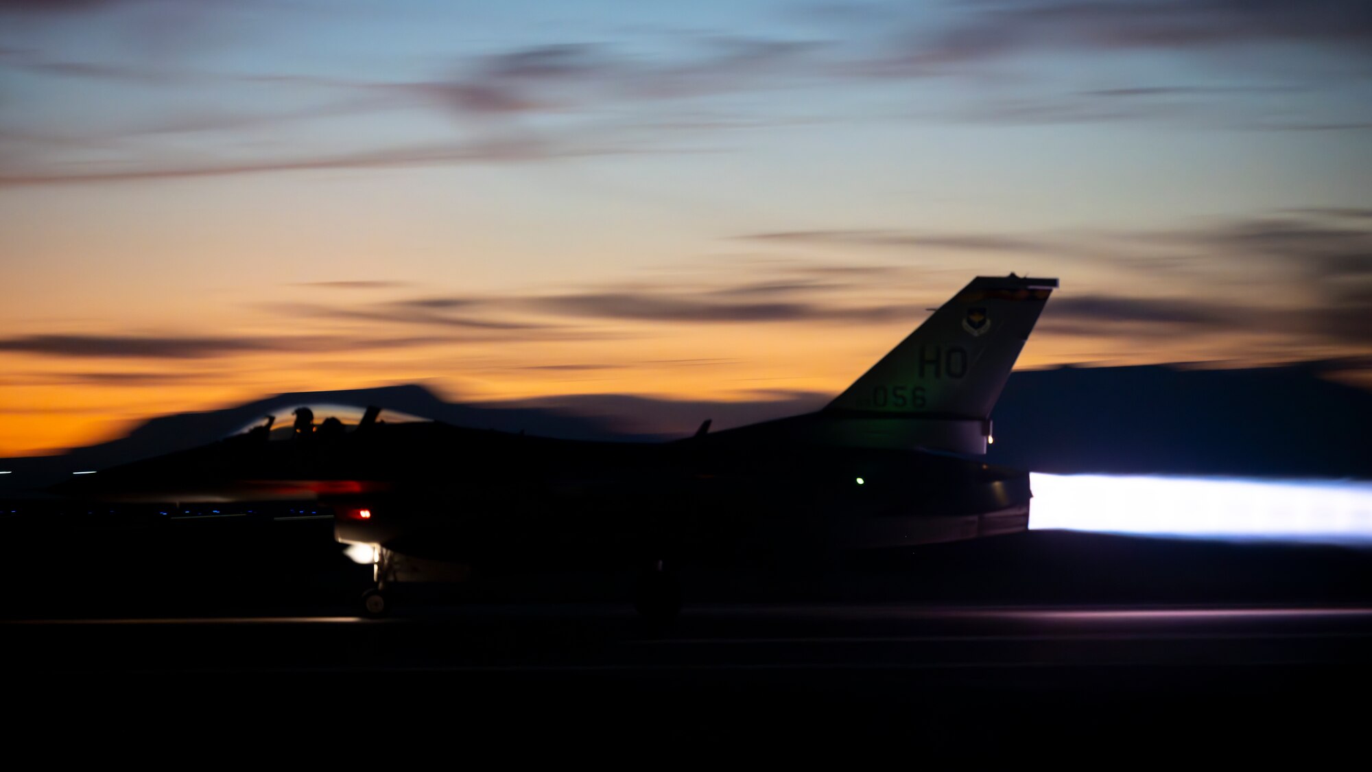 An F-16 Fighting Falcon assigned to the 54th Operations Group takes off for a nighttime training sortie at Holloman Air Force Base, New Mexico, Nov. 13, 2025. The 54th FG trains more than 25% of all fighter pilots in the U.S. Air Force, with night operations being a critical part of the curriculum to develop the world’s most skilled F-16 pilots. (U.S. Air Force photo by Tech. Sgt. Victor J. Caputo)
