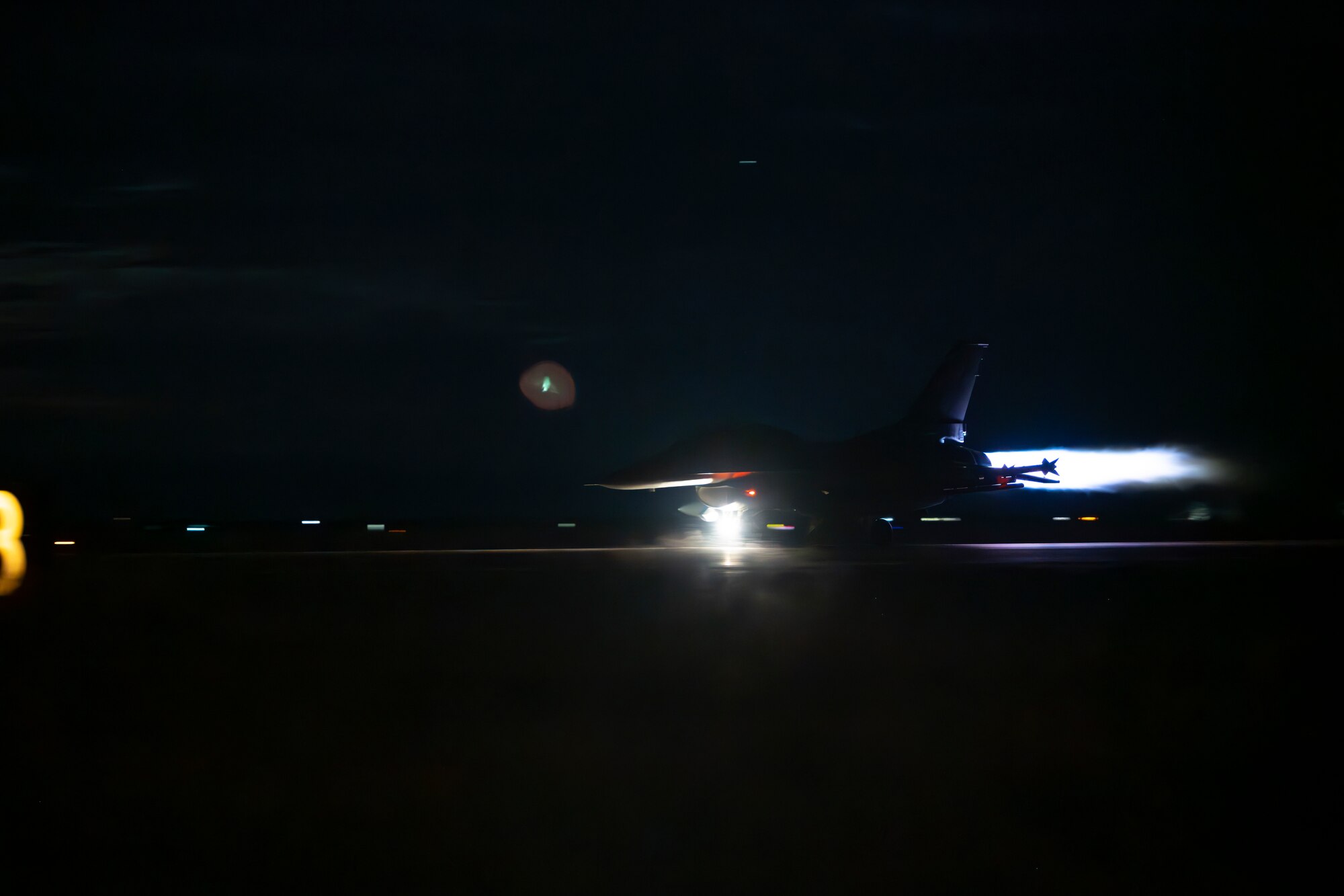 An F-16 Fighting Falcon assigned to the 54th Operations Group takes off for a nighttime training sortie at Holloman Air Force Base, New Mexico, Nov. 13, 2025. The 54th FG trains more than 25% of all fighter pilots in the U.S. Air Force, with night operations being a critical part of the curriculum to develop the world’s most skilled F-16 pilots. (U.S. Air Force photo by Tech. Sgt. Victor J. Caputo)