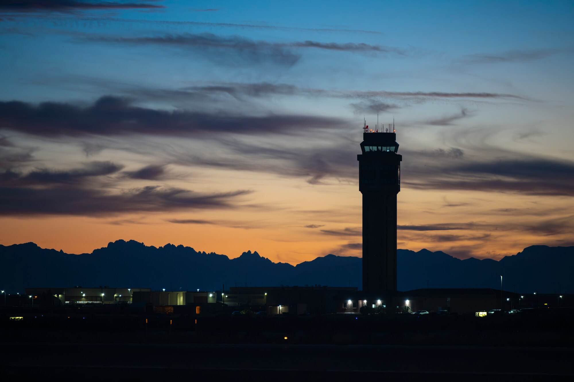 Air traffic controllers from the 54th Operations Support Squadron man the air traffic control tower during evening flight operations at Holloman Air Force Base, New Mexico, Nov. 13, 2025. The 54th OSS is a critical part of the 49th Wing mission of training the world’s most skilled F-16 Fighting Falcon pilots and MQ-9 Reaper pilots and sensor operators. (U.S. Air Force photo by Tech. Sgt. Victor J. Caputo)