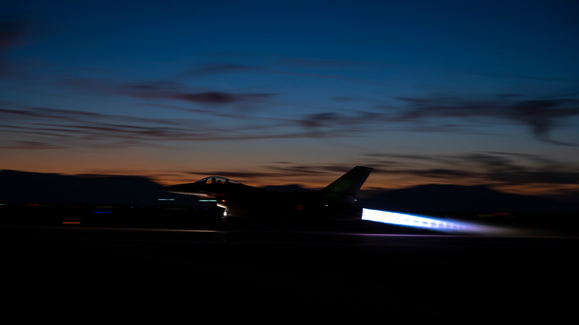 An F-16 Fighting Falcon assigned to the 54th Operations Group takes off for a nighttime training sortie at Holloman Air Force Base, New Mexico, Nov. 13, 2025. The 54th FG trains more than 25% of all fighter pilots in the U.S. Air Force, with night operations being a critical part of the curriculum to develop the world’s most skilled F-16 pilots. (U.S. Air Force photo by Tech. Sgt. Victor J. Caputo)