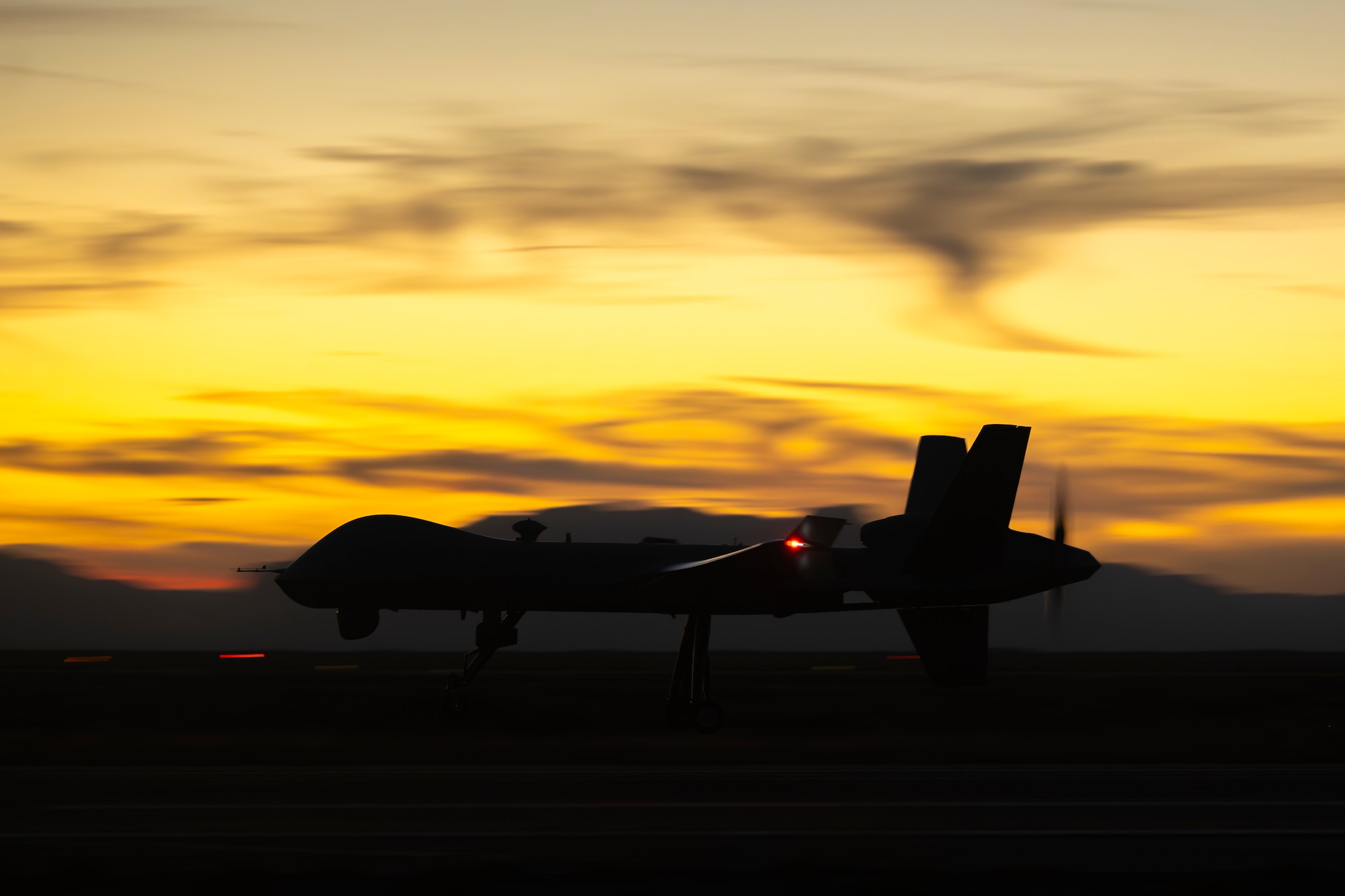 An MQ-9 Reaper assigned to the 49th Operations Group lands after completing a training sortie at Holloman Air Force Base, New Mexico, Nov. 13, 2025. The 49th OG is responsible for training the majority of the Air Force’s MQ-9 pilots and sensor operators in addition to assisting other branches, such as the U.S. Marine Corps, and NATO allies with their own Reaper training programs. (U.S. Air Force photo by Tech. Sgt. Victor J. Caputo)
