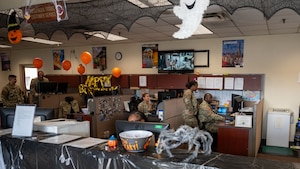U.S. Air Force Airmen assigned to the 51st Logistics Readiness Squadron, work together in the passenger travel office, at Osan Air Base, Republic of Korea, Oct. 22, 2025. The duties include overseeing travel and household goods shipments for Airmen and their families. (U.S. Air Force photo by Senior Airman Rome Bowermaster)