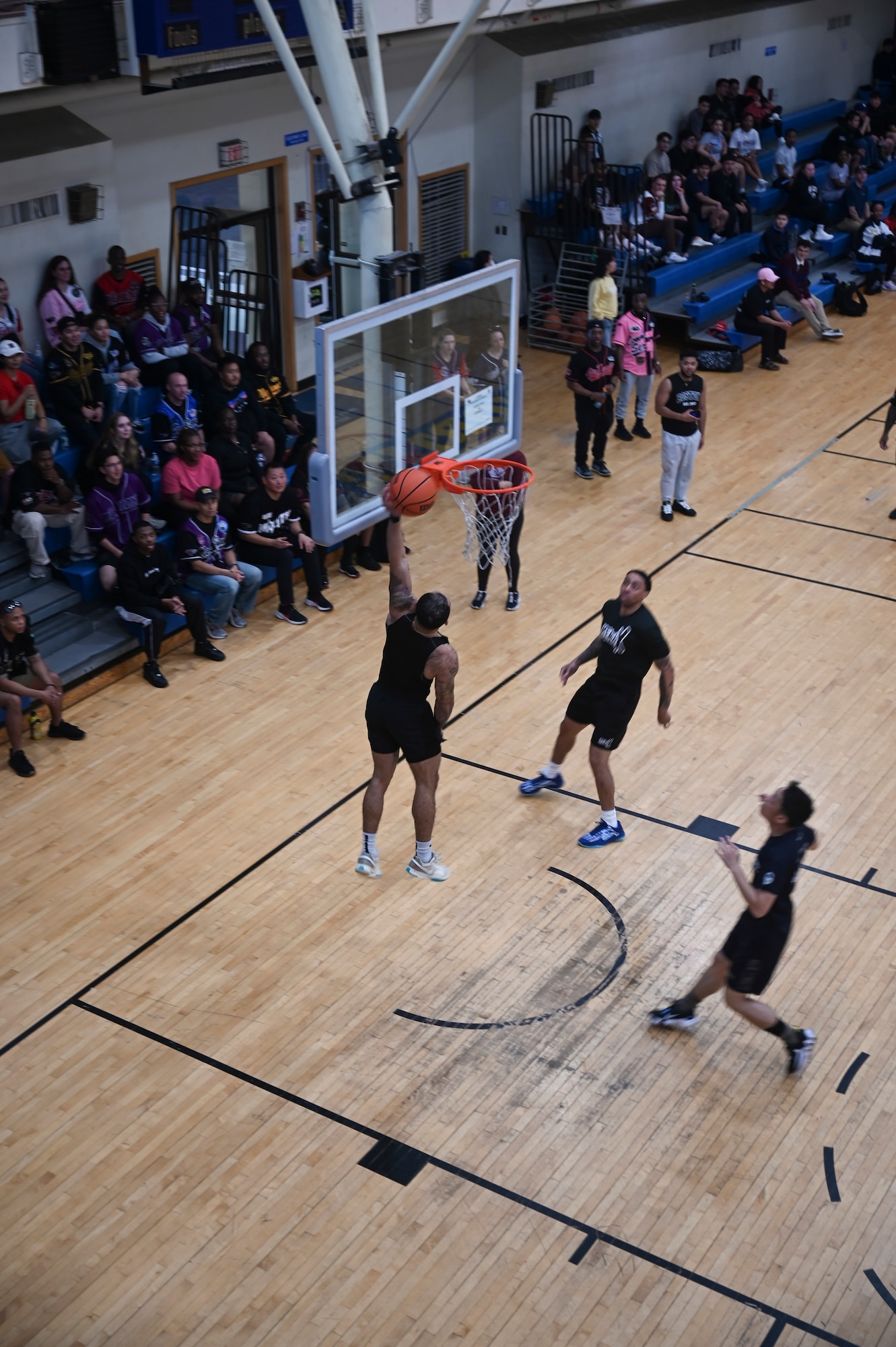 A man jumps on a court.