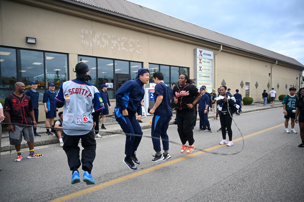 A group jumps rope.