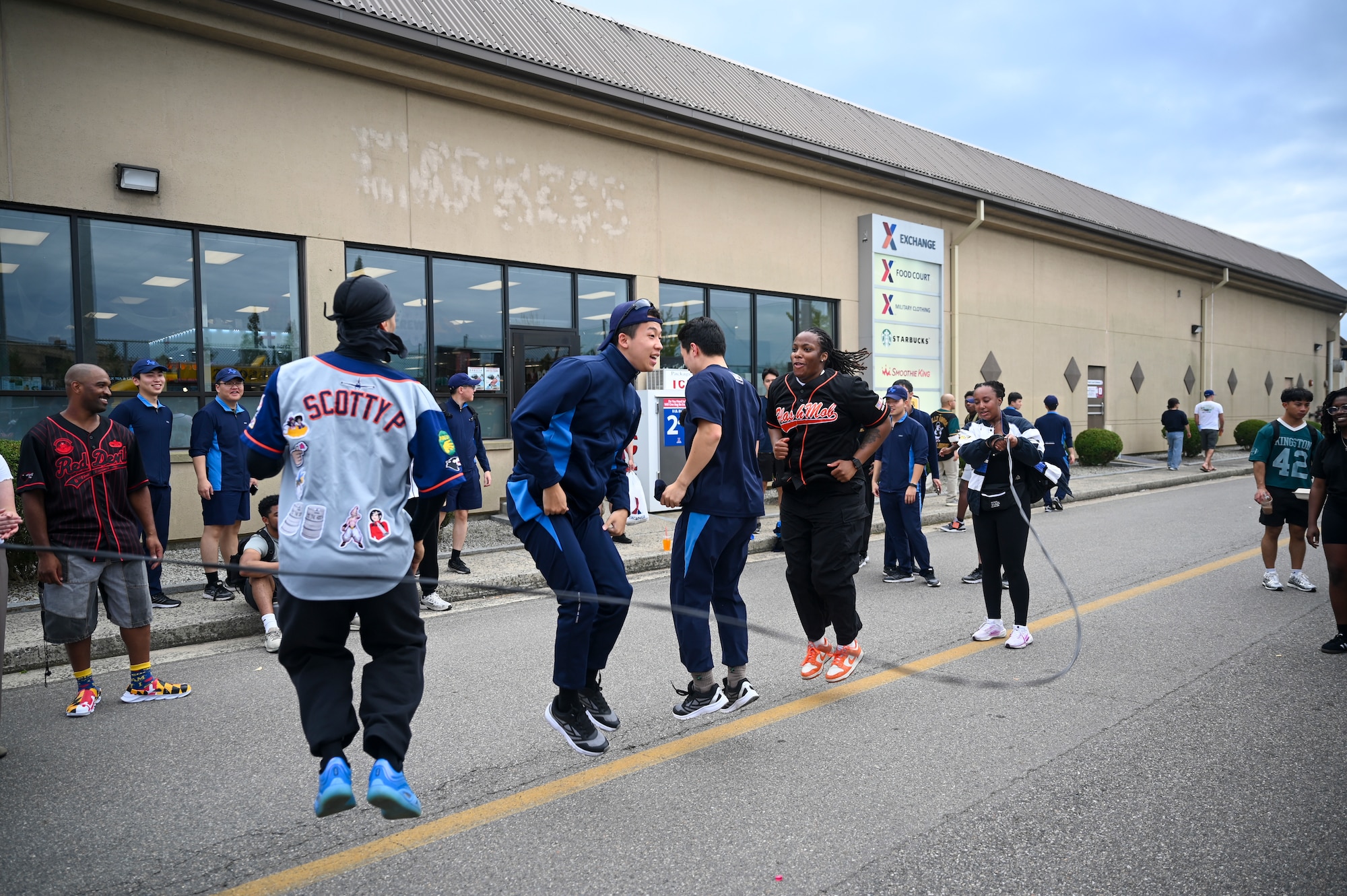 A group jumps rope.