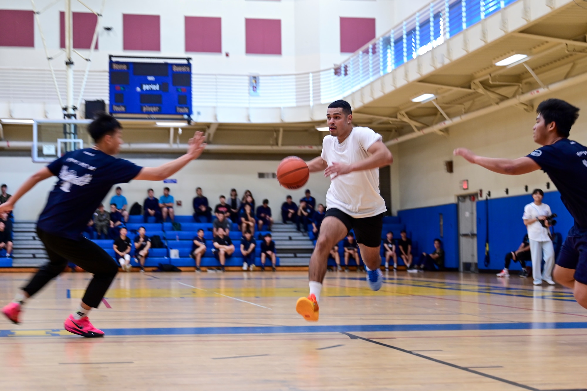 A man bounces a ball.