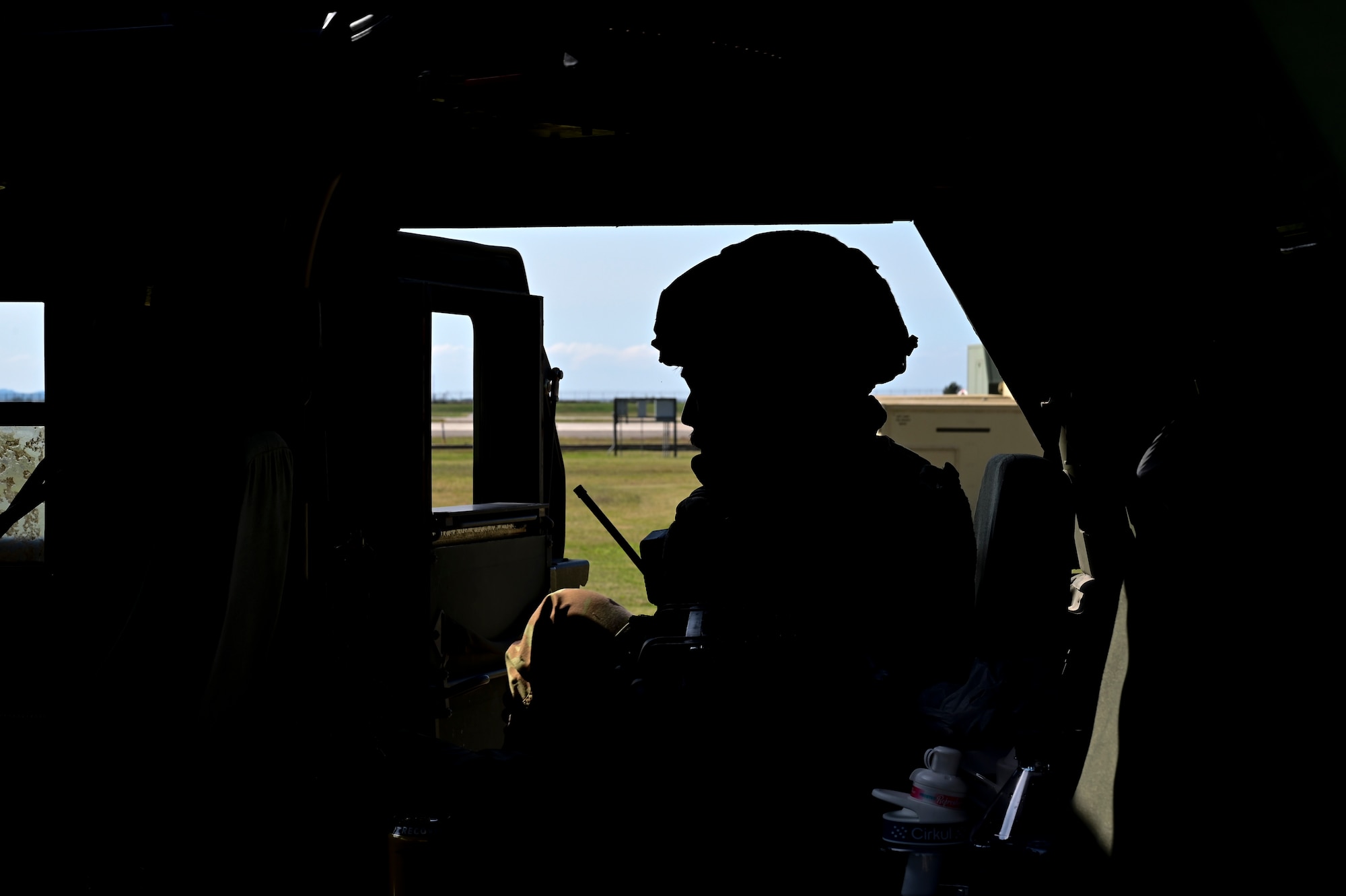 A man sits in a vehicle.