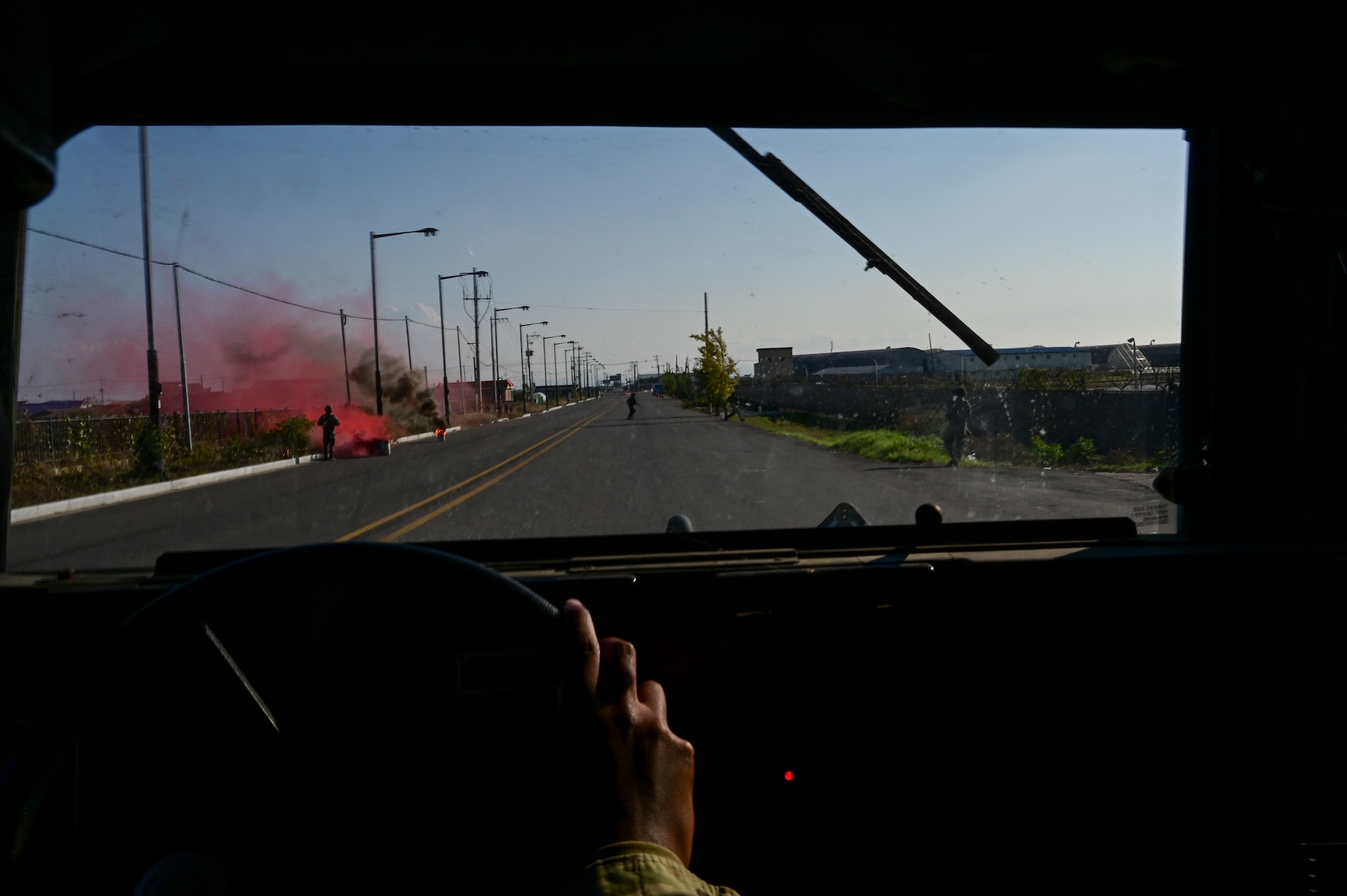 A person drives a vehicle.