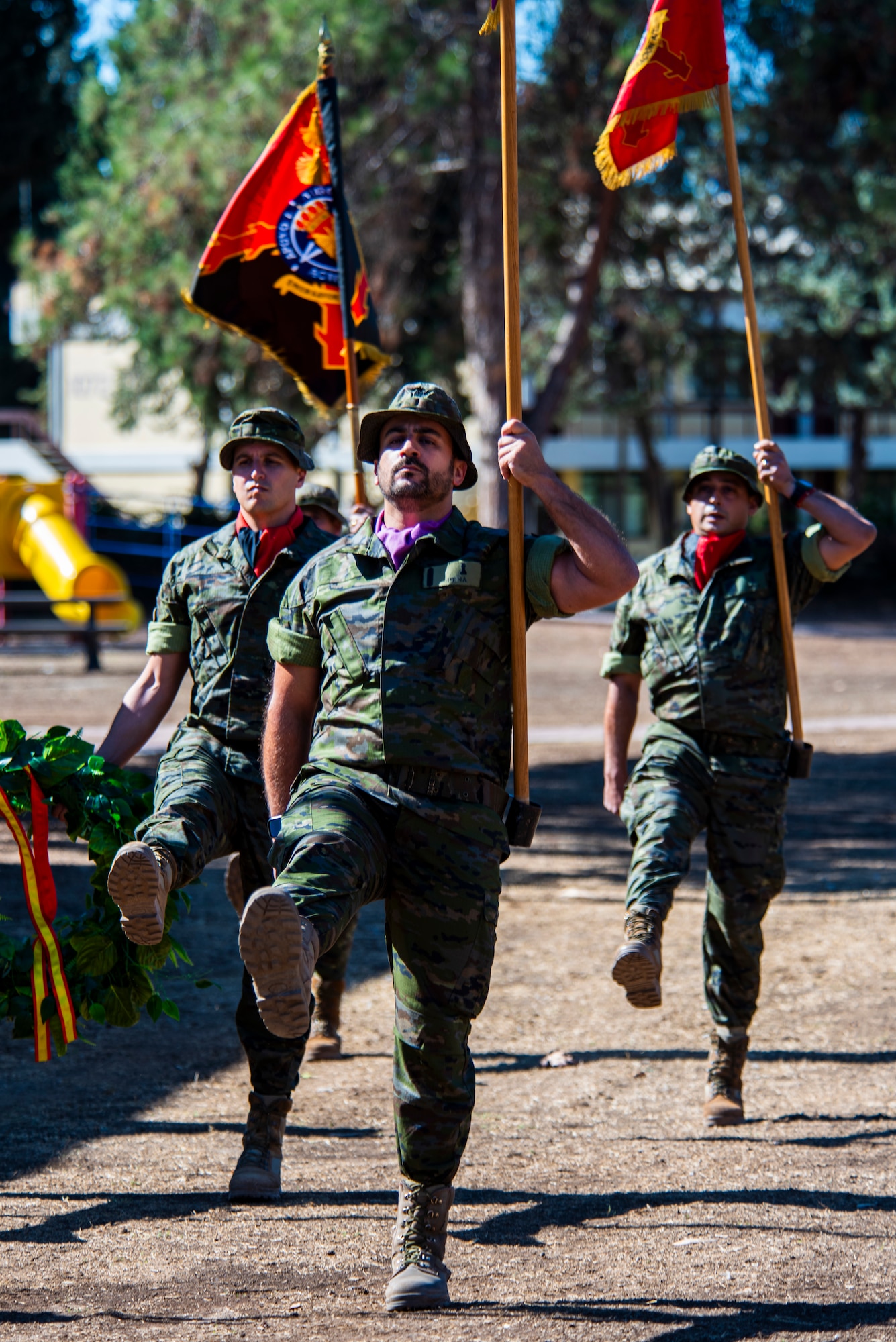 Service members carry their unit colors