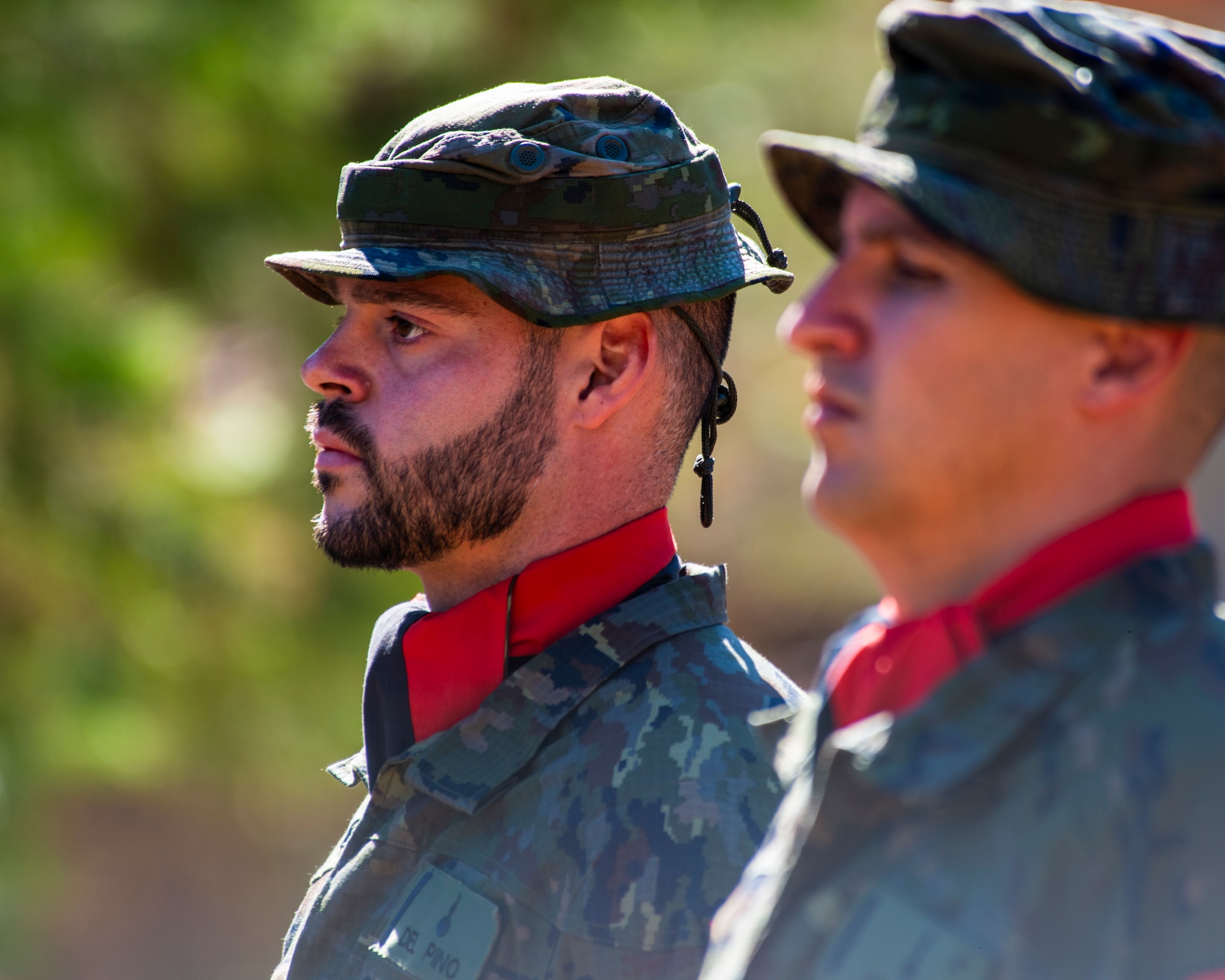 Service members stand in formation
