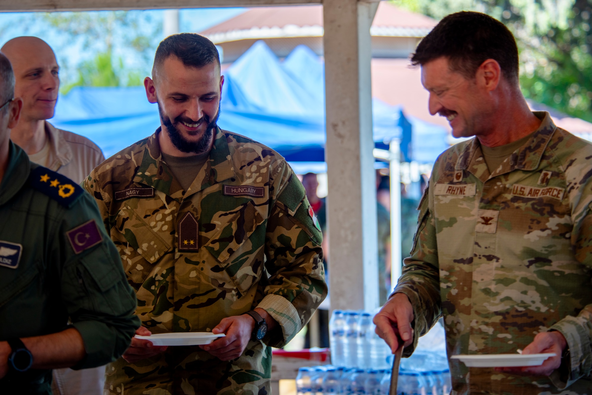 Service members share a meal