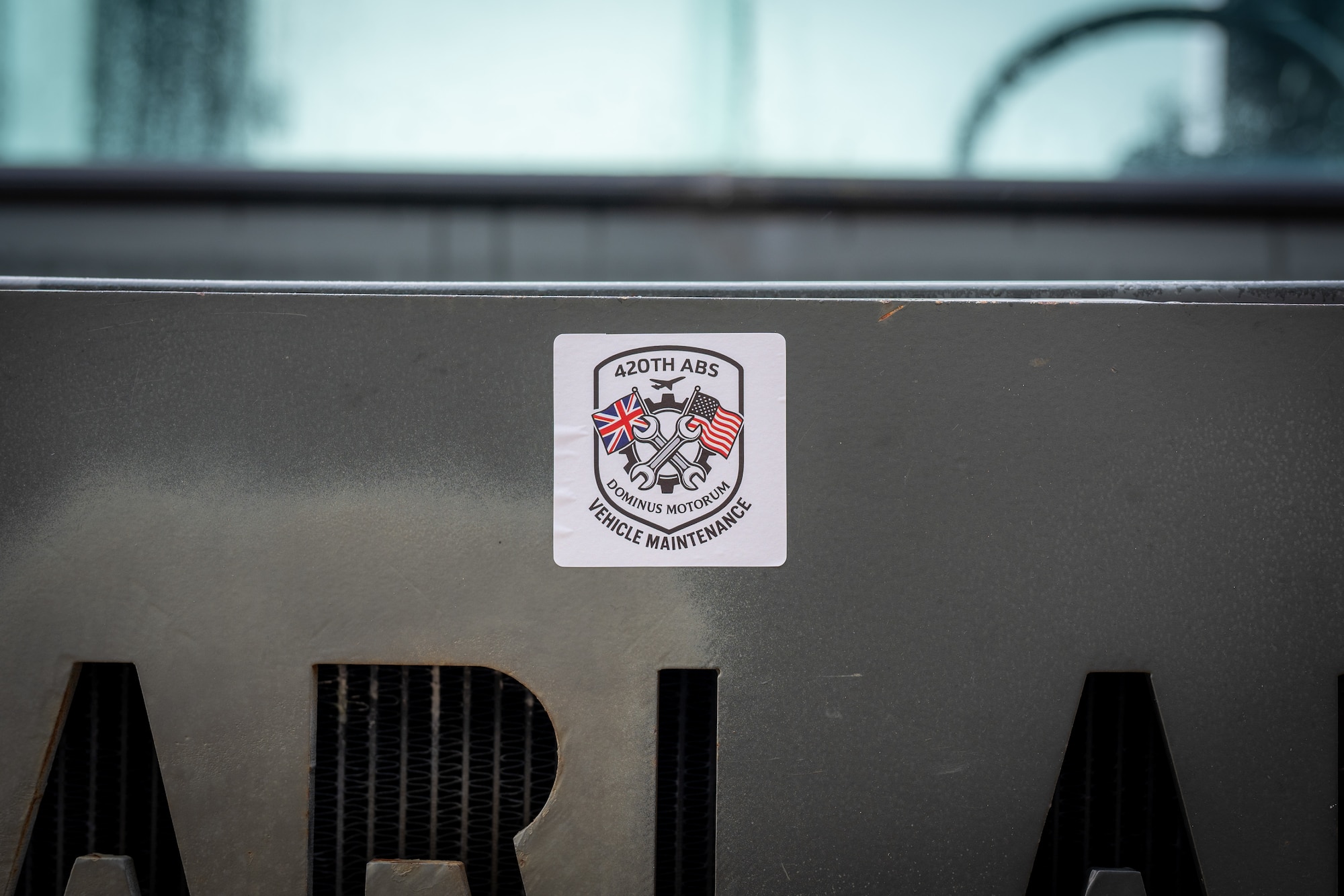 A 420th Air Base Squadron Logistics Readiness Vehicle Management (LGRV) emblem is displayed at RAF Fairford, England, Oct. 16, 2025. The 420th LGRV Vehicle Management shop maintains and repairs vehicles that support aircraft, airfield operations, and base logistics. (U.S. Air Force photo by Airman 1st Class Adam Enbal)