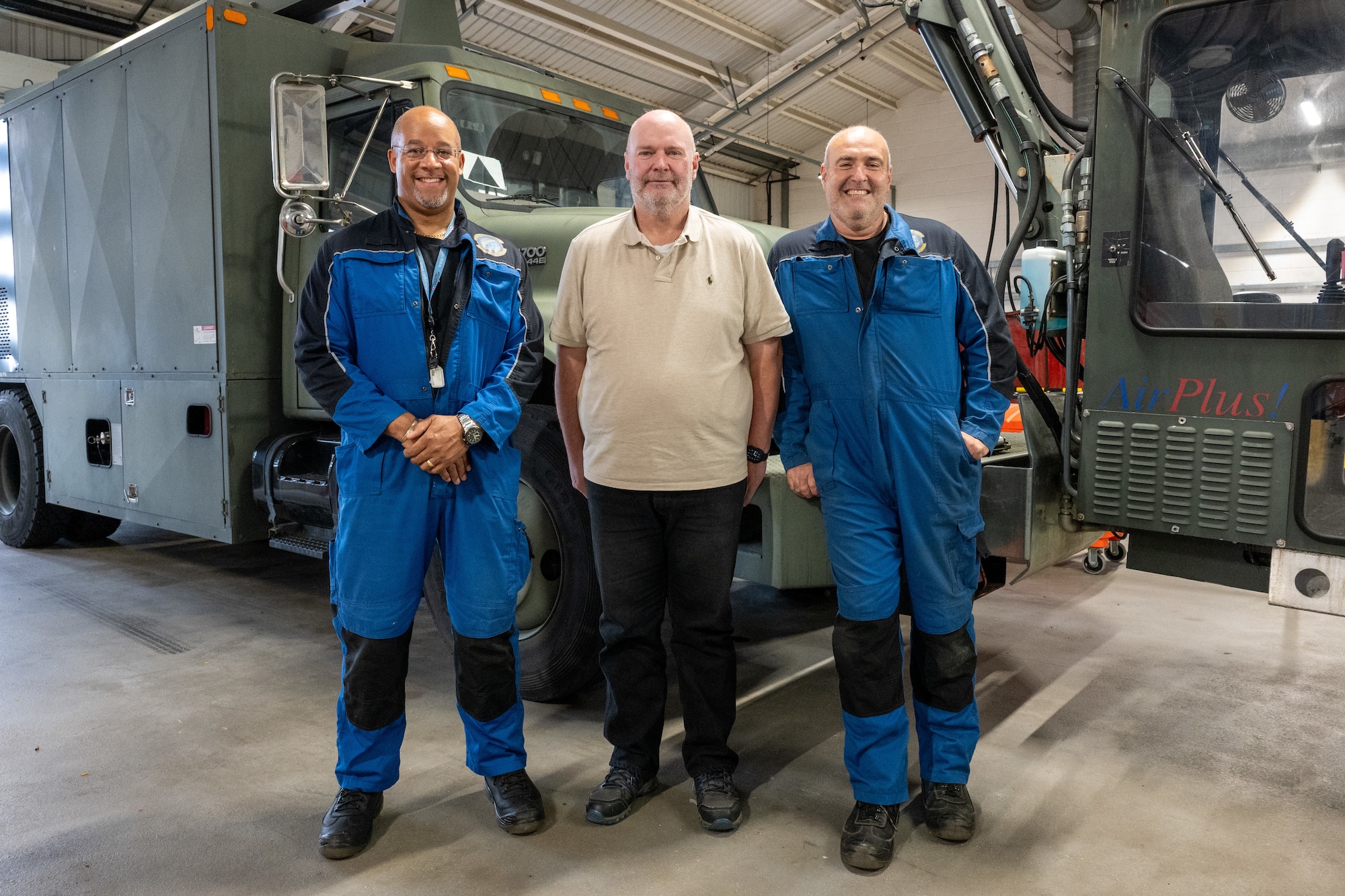 Members from the 420th Air Base Squadron Logistics Readiness Flight Vehicle Management shop pose for a photo at RAF Fairford, England, Oct. 24, 2025. The 420th LGRV Vehicle Management shop maintains and repairs vehicles that support aircraft, airfield operations, and base logistics. (U.S. Air Force photo by Airman 1st Class Adam Enbal)
