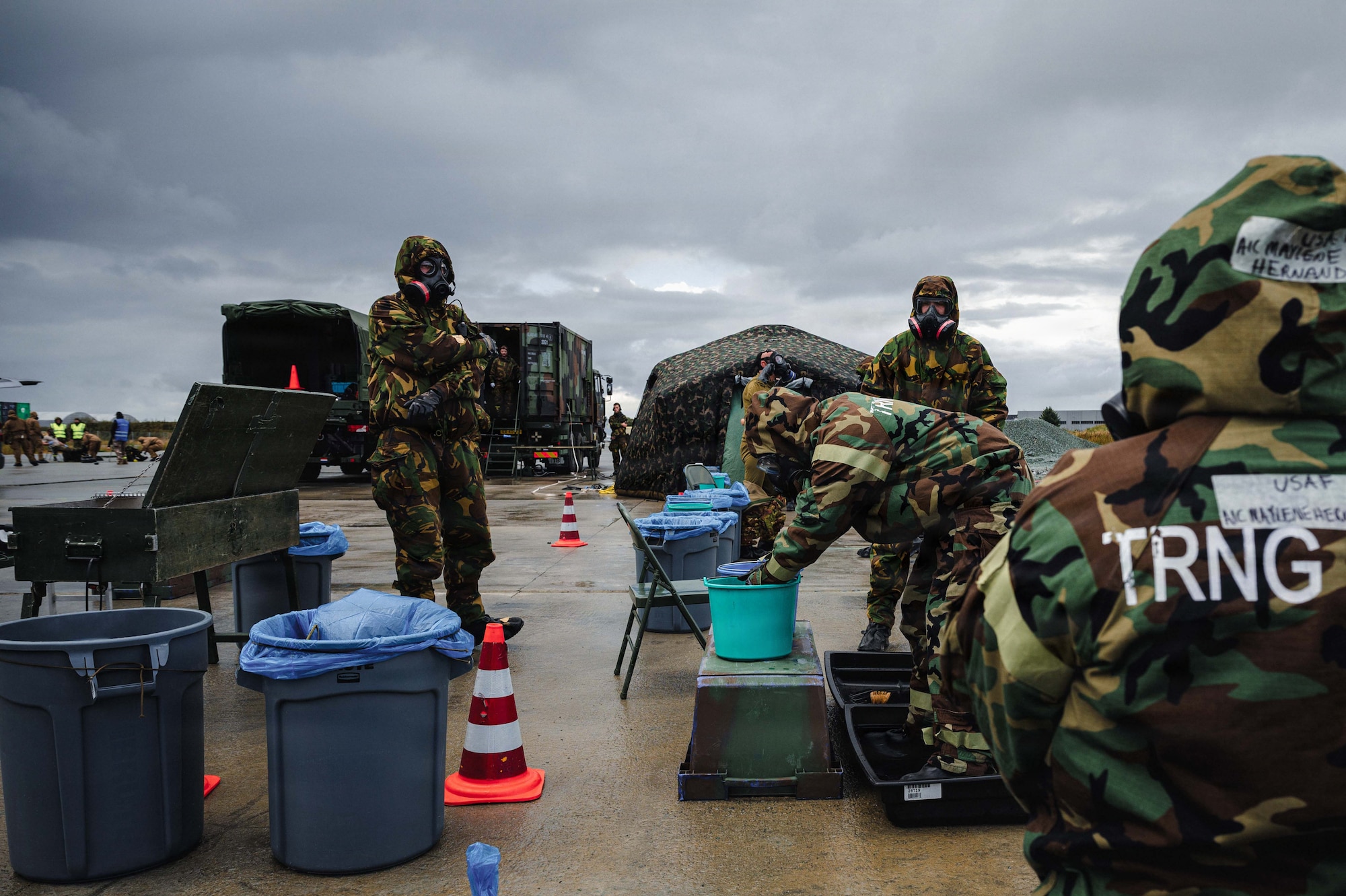 Royal Netherlands Air and Space Force service members simulate decontamination processes during exercise Toxic Trip 25 at Ørland Air Base, Norway, Sept. 22, 2025. During TT25, Allied emergency management specialists conducted protective training and served as the primary Chemical, Biological, Radiological and Nuclear forces, performing response operations, warnings, and reporting to support critical scenarios. (U.S. Air Force photo by Senior Airman Sabrina Fuller-Judd)