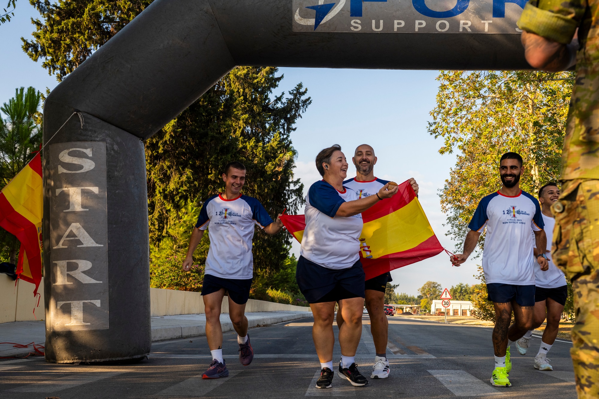 Spanish participants cross the finish line
