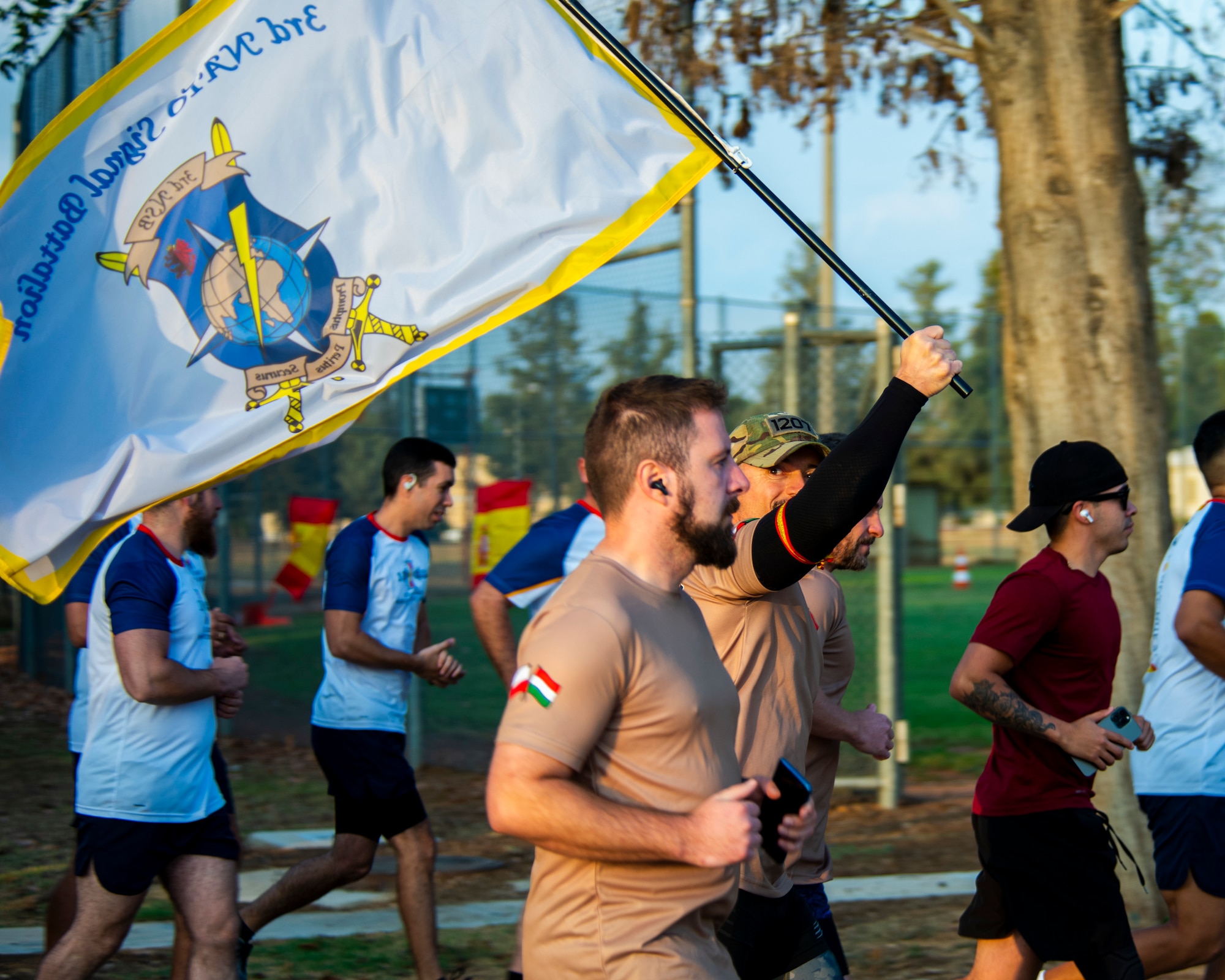 A participant carries a flag