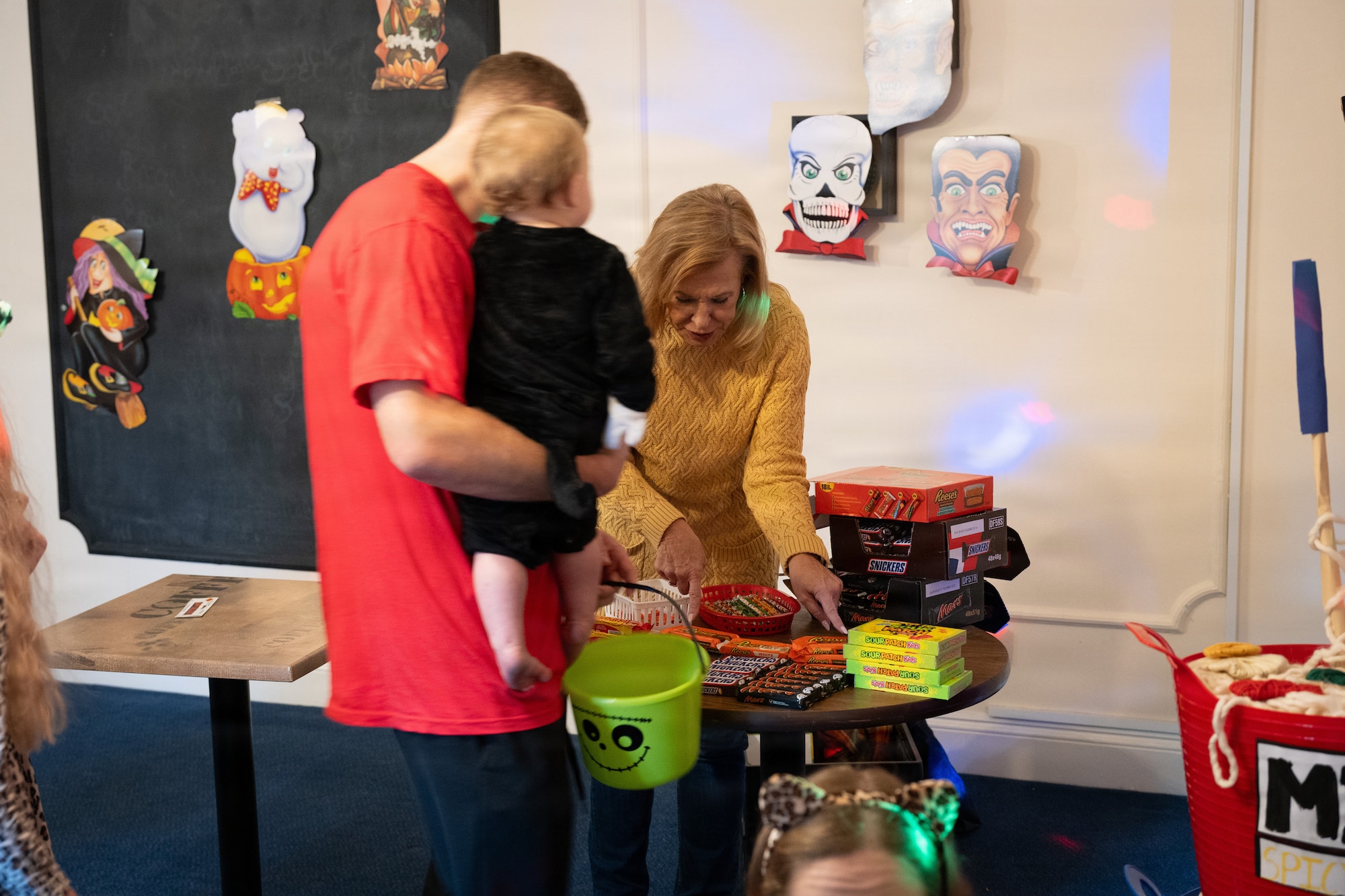 Volunteers hand out candy