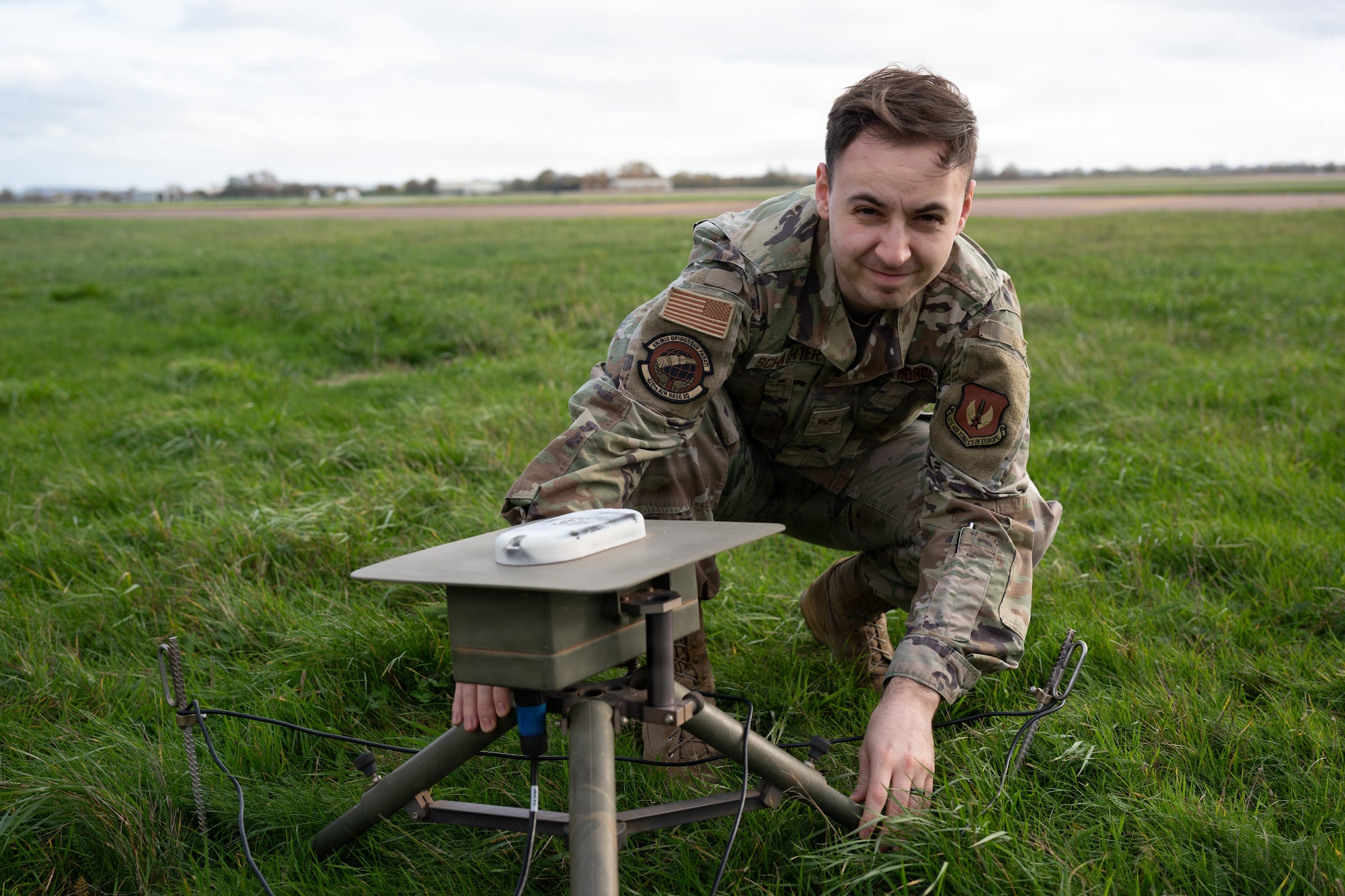 U.S. Air Force Senior Airman Jacob A. Schachter, 420th Air Base Squadron Weather Forecaster, positions a surface sensor