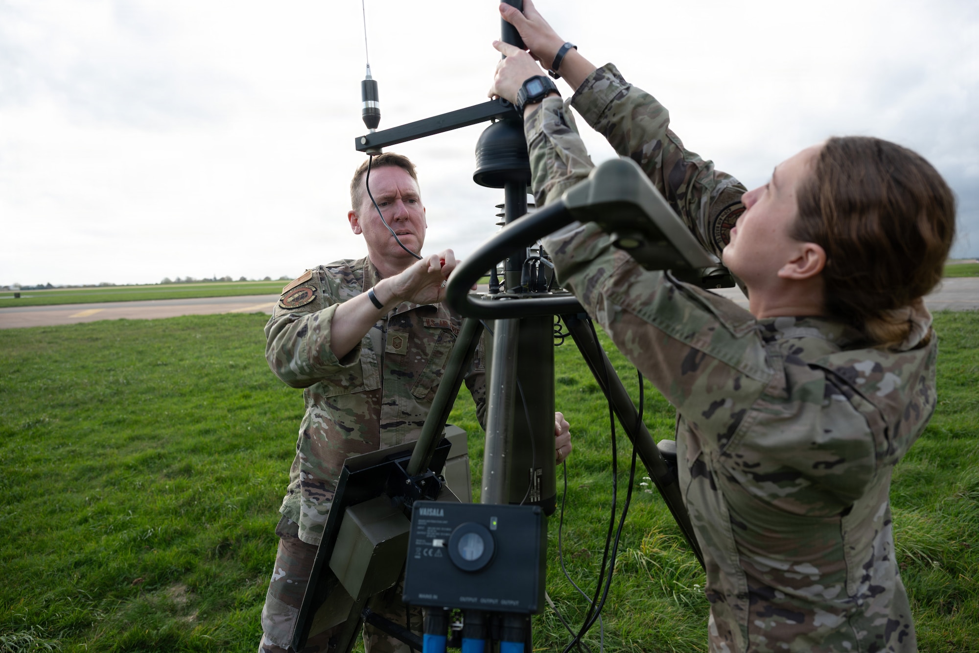 U.S. Air Force 1st Lt. Grace Kimzey, 420th Air Base Squadron Weather Flight Commander, and Master Sgt. Robert Welborn, 420th Air Base Squadron Flight Chief of Weather Operations, assembles components