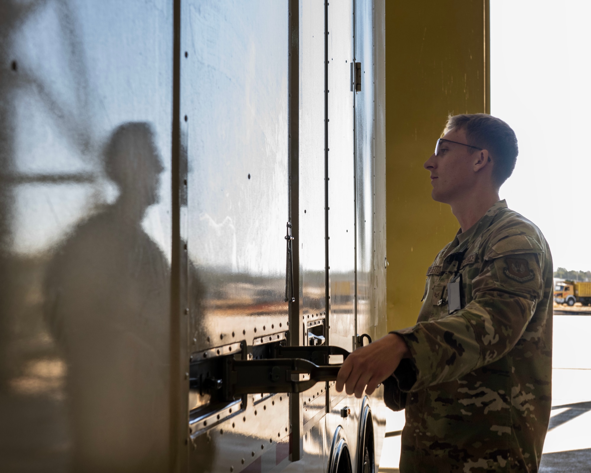 A service member opens a trailer