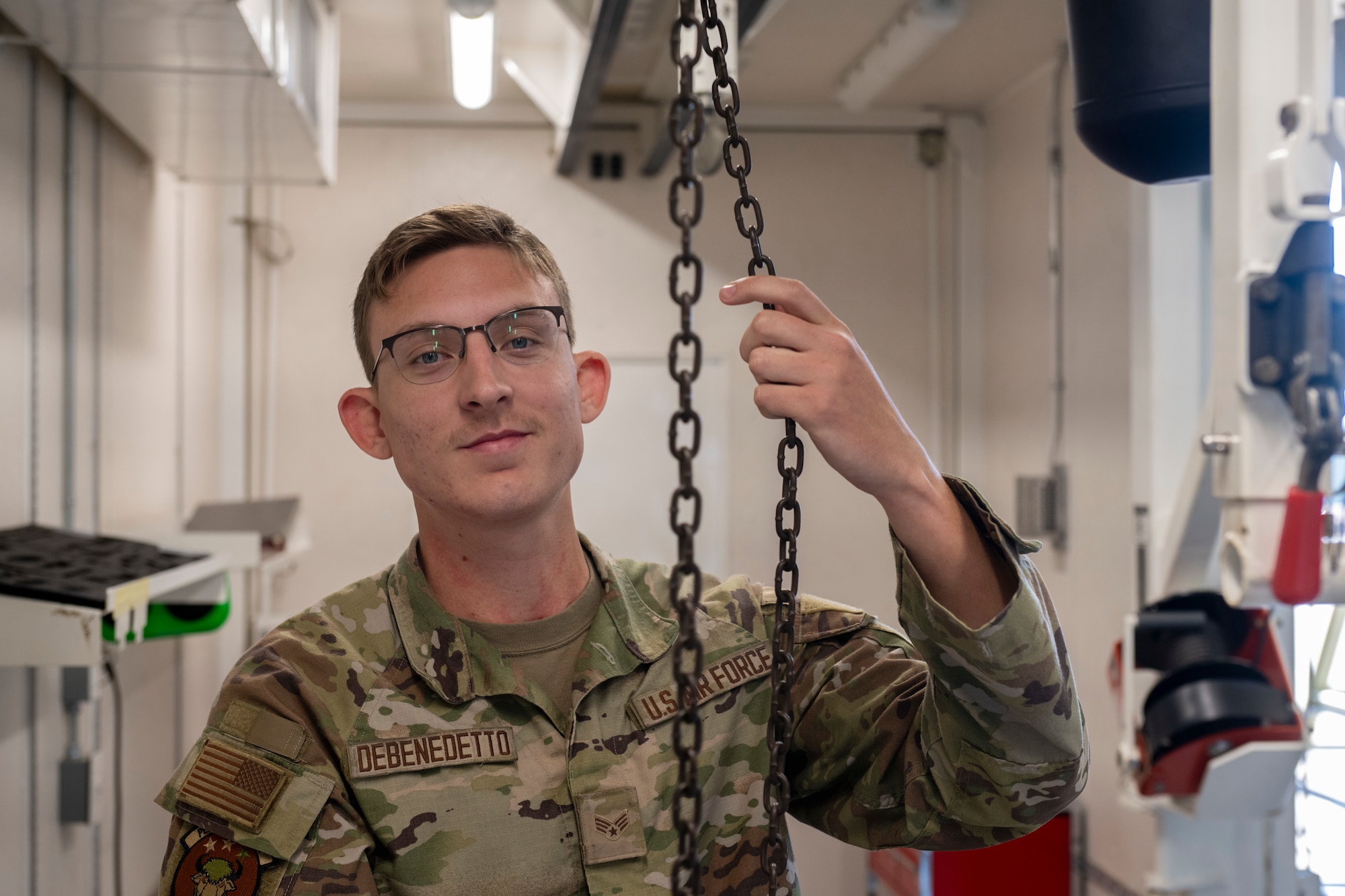 A service member  poses for a photo