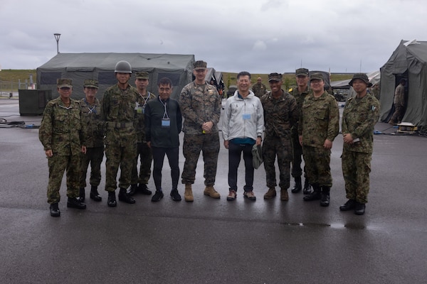 U.S. Marines, Sailors, Japanese Ground Self-Defense Force members, and civilian medical personnel pose for a photo during exercise 07JX on Ishigaki, Okinawa, Japan, Oct 25, 2025. 07JX is a bilateral exercise that aims to enhance bilateral Japan-U.S. capabilities for humanitarian assistance and disaster relief operations in the Southwest islands. (U.S. Marine Corps photo by Lance Cpl. Marcus Henson)