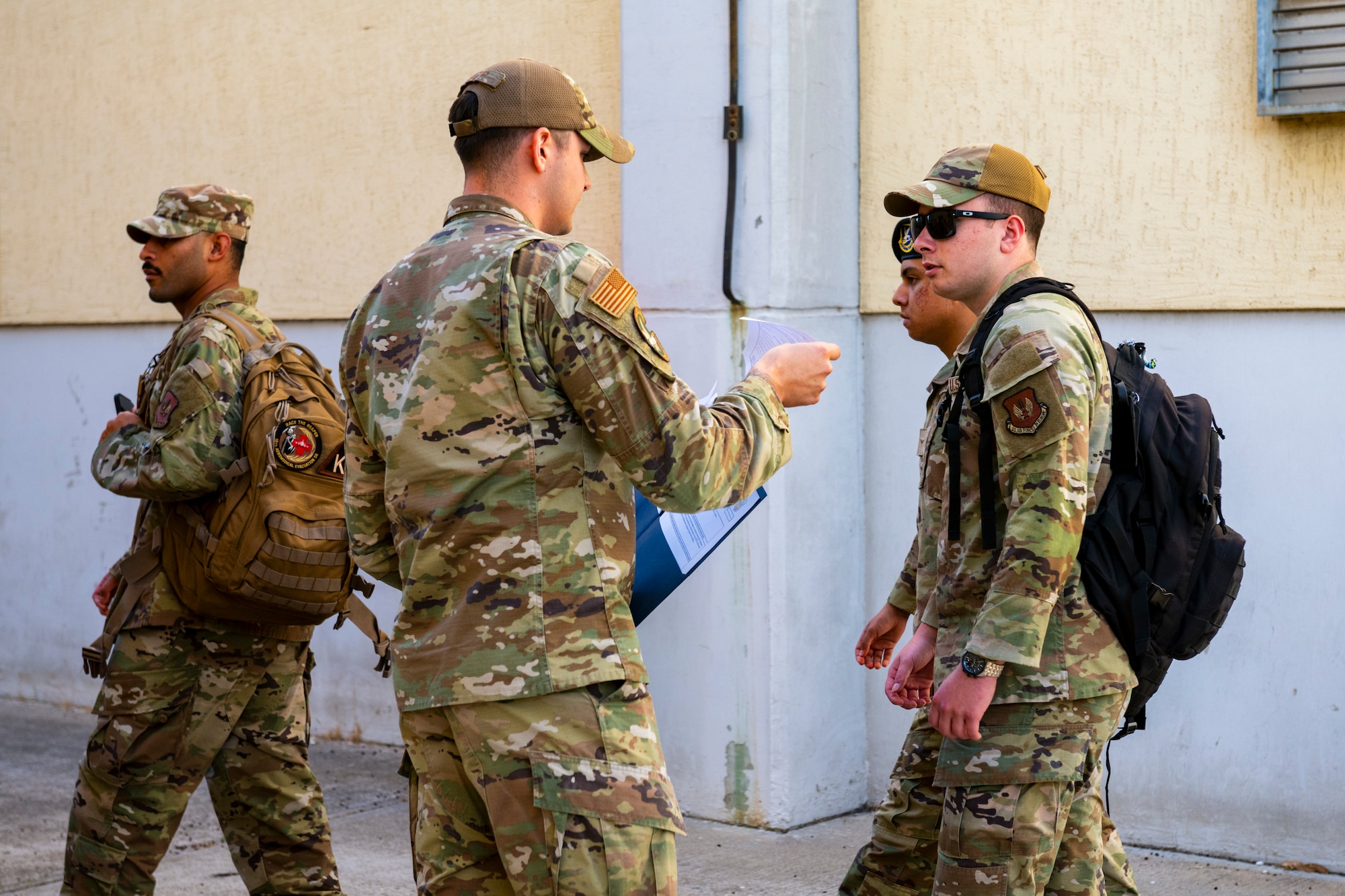 Service members participate in simulated deployment processing operations