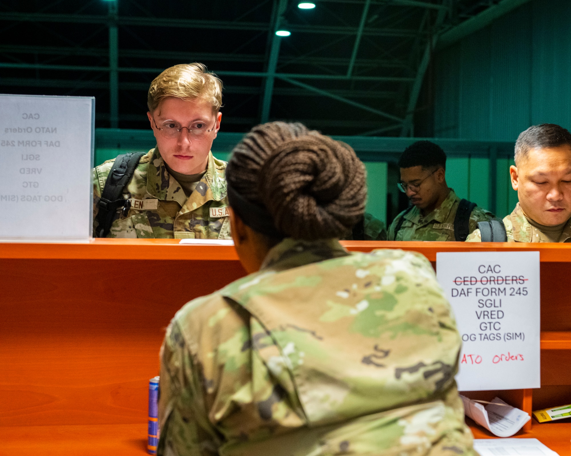 A service member checks in