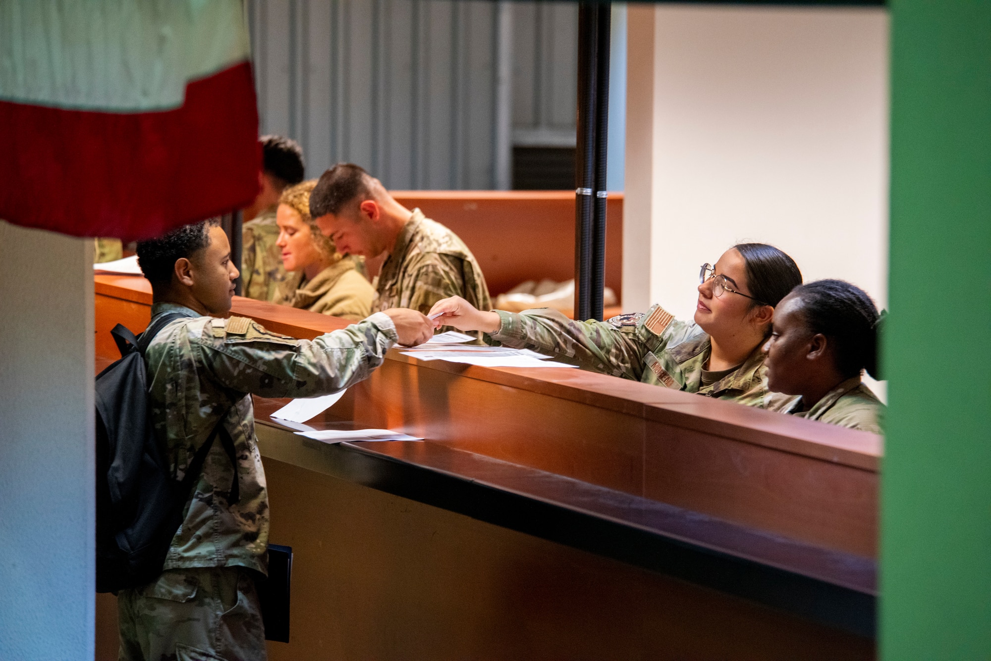 A service member finalizes in-processing paperwork