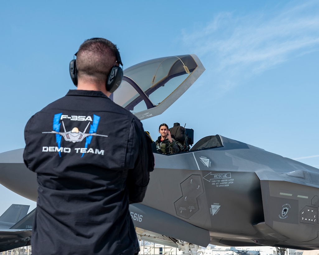 U.S. Air Force Staff Sgt. Jacob Sackett, a dedicated crew chief assigned to the F-35A Lightning II Demonstration Team, stands by before takeoff at Al Dhafra Air Base, United Arab Emirates, on Nov. 17, 2025. The team is performing at the Dubai Airshow to showcase the capabilities of the F-35A to nations around the globe. (U.S. Air Force photo by Staff Sgt. Nicholas Rupiper)