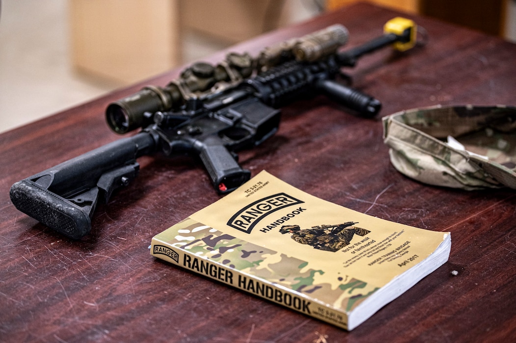 A Ranger Handbook lays on the table at Moody Air Force Base, Georgia, Oct. 7, 2025. The handbook serves as a key reference for Airmen during the Ranger Assessment and Preparation Course, outlining the tactics, standards and mindset required to earn the Ranger tab. (U.S. Air Force photo by Senior Airman Leonid Soubbotine)