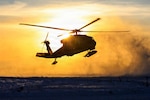 A U.S. Army National Guard UH-60L Black Hawk helicopter, assigned to the 207th Aviation Troop Command, Alaska Army National Guard, approaches Napaskiak, Alaska, during post-storm recovery efforts for Operation Halong Response, Oct. 27, 2025. Alaska Organized Militia members, including Alaska Air and Army National Guardsmen and members of the Alaska Naval Militia and Alaska State Defense Force, continue coordinated response operations in support of the State Emergency Operations Center following Typhoon Halong. Photo by Capt. Balinda O’Neal.