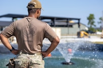 U.S. Air Force Airman 1st Class Jheriko Watson, 11th Civil Engineer Squadron water and fuel systems maintenance technician at Joint Base Anacostia-Bolling, Washington, D.C., surveys a fresh water source during water purification training at Tyndall Air Force Base, Fla., Sept. 18, 2025.