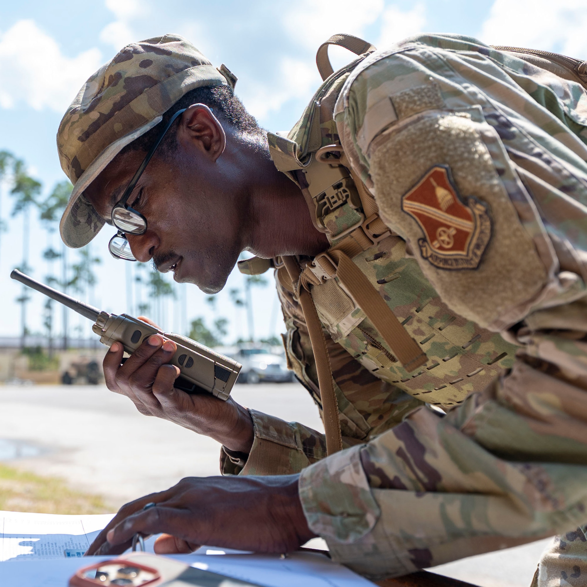 U.S. Air Force Staff Sgt. Aaron Blake, 11th Civil Engineer Squadron water and fuel systems maintenance technician at Joint Base Anacostia-Bolling, Washington, D.C., communicates with the exercise command center at Tyndall Air Force Base, Fla., Sept. 18, 2025.