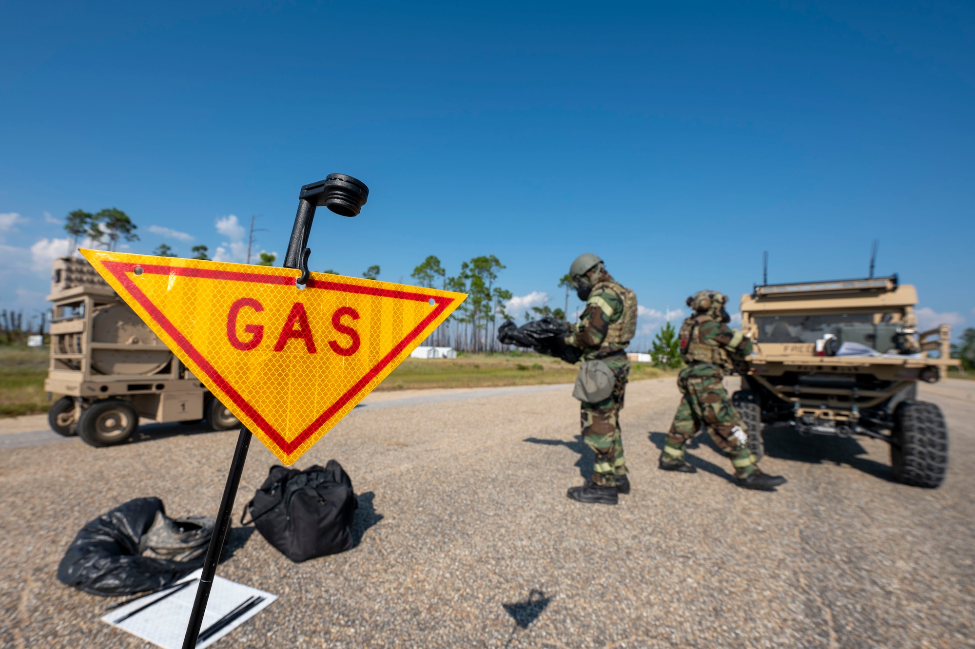 U.S. Air Force Senior Airman Cobe Curry, left, 87th Civil Engineer Squadron Emergency Management Flight, Joint Base McGuire-Dix-Lakehurst, N.J., and Staff Sgt. Keri Gade Rimas, 11th Security Forces Squadron, Joint Base Anacostia-Bolling, Washington, D.C., assess simulated contamination levels during a training exercise at Tyndall Air Force Base, Fla., Sept. 18, 2025.