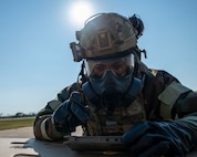 U.S. Air Force Senior Airman Cobe Curry, 87th Civil Engineer Squadron Emergency Management Flight, Joint Base McGuire-Dix-Lakehurst, N.J., assesses a simulated chemical attack at Tyndall Air Force Base, Fla., Sept. 18, 2025.