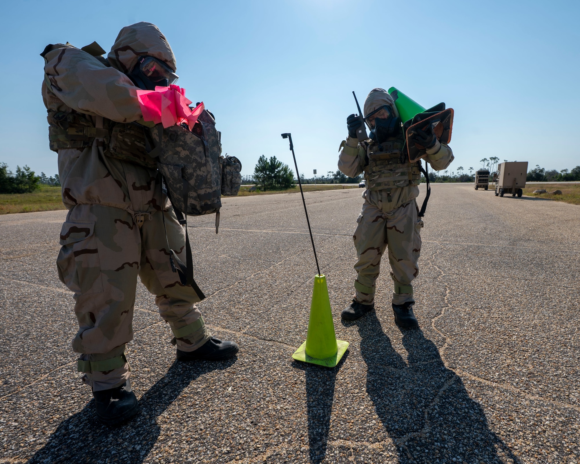 U.S. Air Force Airman First Class Daniel Garcia, left, 11th Security Forces Squadron, Joint Base Anacostia-Bolling, Washington, D.C., and Senior Airman Jennifer Fusaro, 87th Civil Engineer Squadron Emergency Management Flight, Joint Base McGuire-Dix-Lakehurst, N.J., respond to a simulated chemical attack at Tyndall Air Force Base, Fla., Sept. 18, 2025.