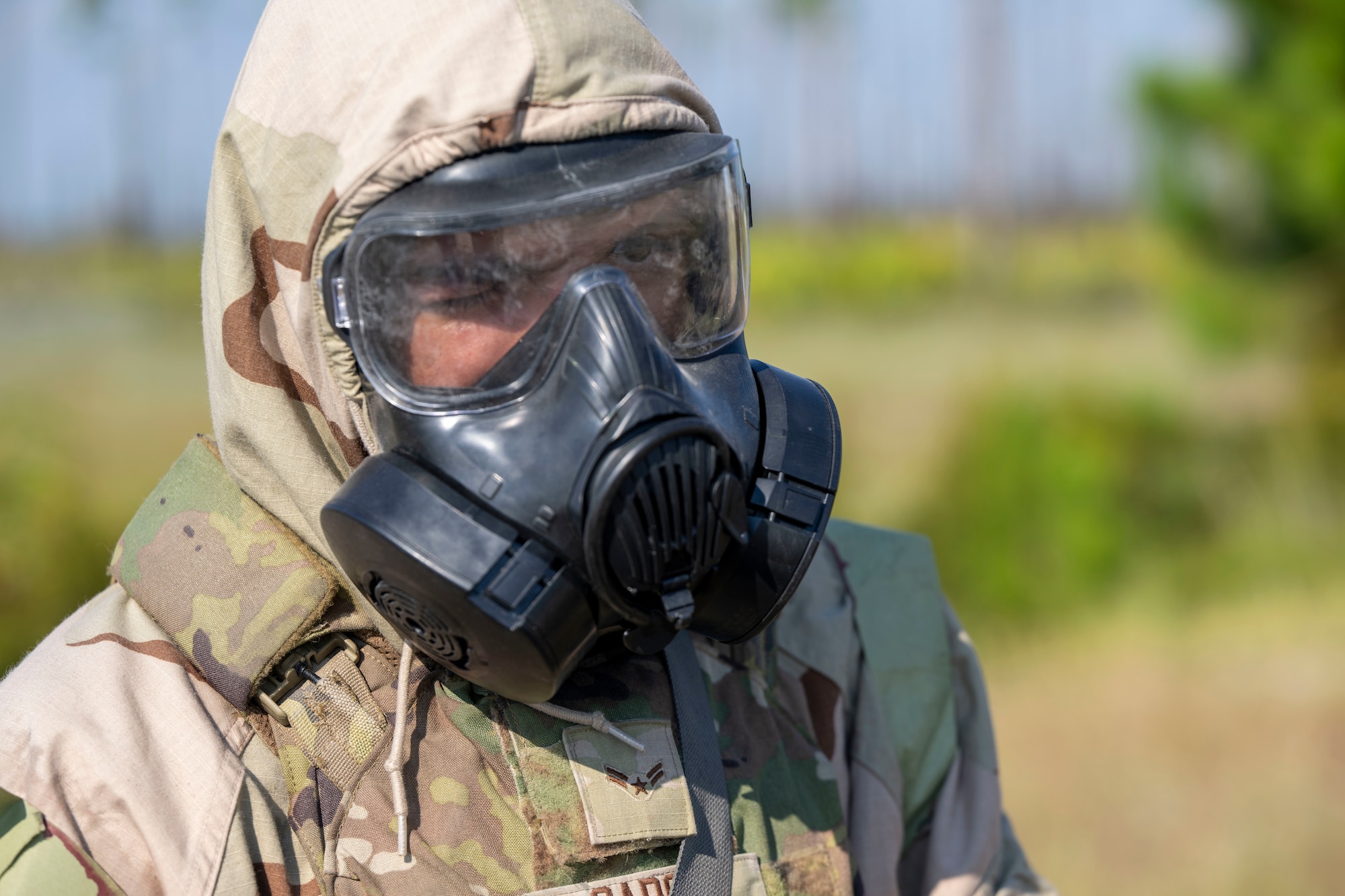U..S. Air Force Airman 1st Class Daniel Garcia, 11th Security Forces Squadron, Joint Base Anacostia-Bolling, Washington, D.C., conducts a simulated combat patrol in Mission Oriented Protective Posture gear at Tyndall Air Force Base, Fla., Sept. 18, 2025.