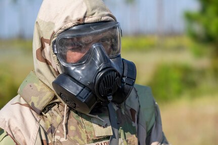 U..S. Air Force Airman 1st Class Daniel Garcia, 11th Security Forces Squadron, Joint Base Anacostia-Bolling, Washington, D.C., conducts a simulated combat patrol in Mission Oriented Protective Posture gear at Tyndall Air Force Base, Fla., Sept. 18, 2025.