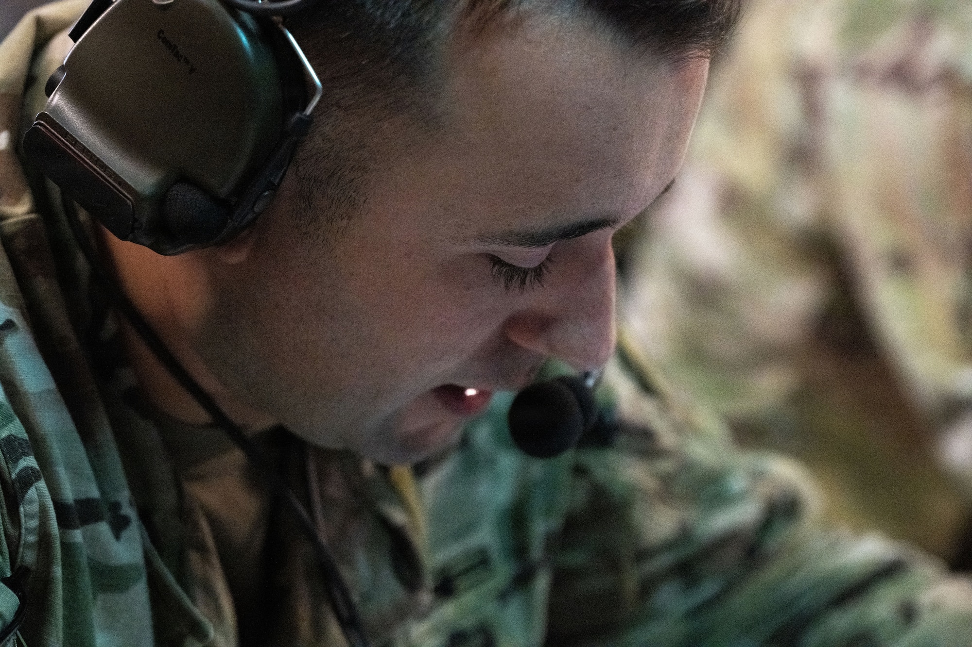U.S. Army Staff Sgt. Mason Love, a joint communicator assigned to the Joint Communications Support Element (JCSE) speaks on a headset using high-frequency radio technology during Exercise Noble Skywave at MacDill Air Force Base, Florida, Oct. 22, 2025. Noble Skywave is an annual, Canadian-led high-frequency radio competition for military units to test and improve their ability to use high-frequency radio technology. JCSE competes to maintain high-frequency expertise and ability to operate in any environment. (U.S. Air Force photo by Airman Alexis Adams)