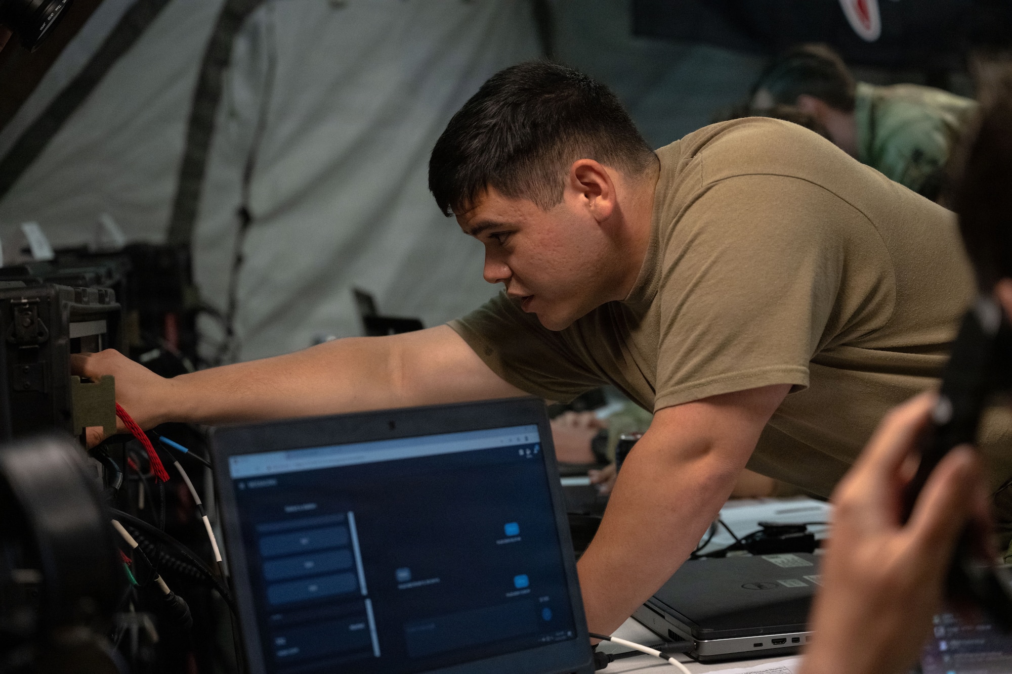 U.S. Air Force Senior Airman Gavin Martinez, a joint communicator assigned to the Joint Communications Support Element (JCSE), uses high-frequency radio technology during Exercise Noble Skywave at MacDill Air Force Base, Florida, Oct. 22, 2025. Noble Skywave is an annual, Canadian-led high-frequency radio competition for military units to test and improve their ability to use high-frequency radio technology. JCSE competes to maintain high-frequency expertise and ability to operate in any environment. (U.S. Air Force photo by Airman Alexis Adams)